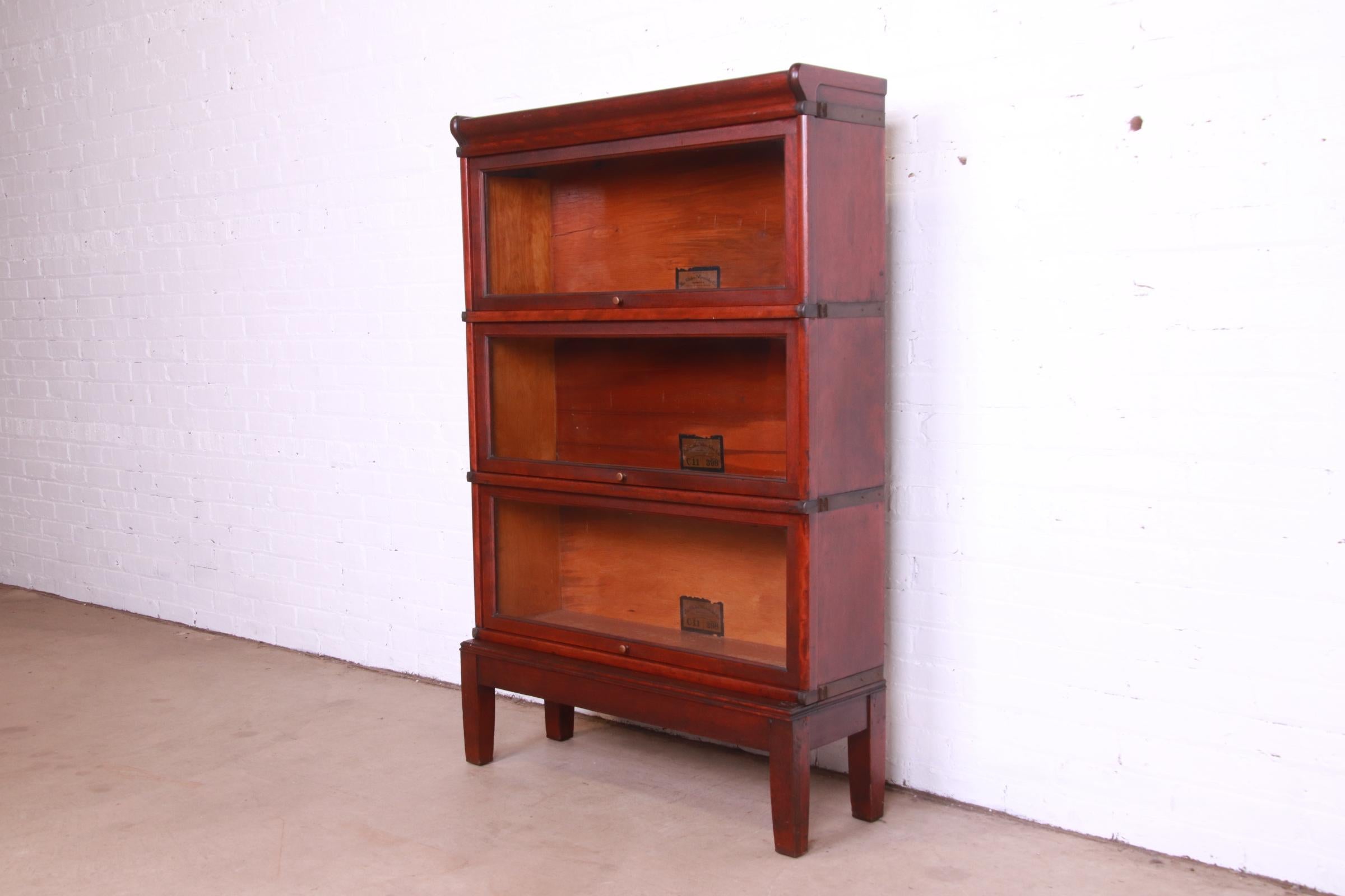 A gorgeous antique Arts & Crafts three-stack lawyer barrister bookcase

By Globe Wernicke

USA, Circa 1890s

Mahogany, with glass doors and brass hardware.

Measures: 34