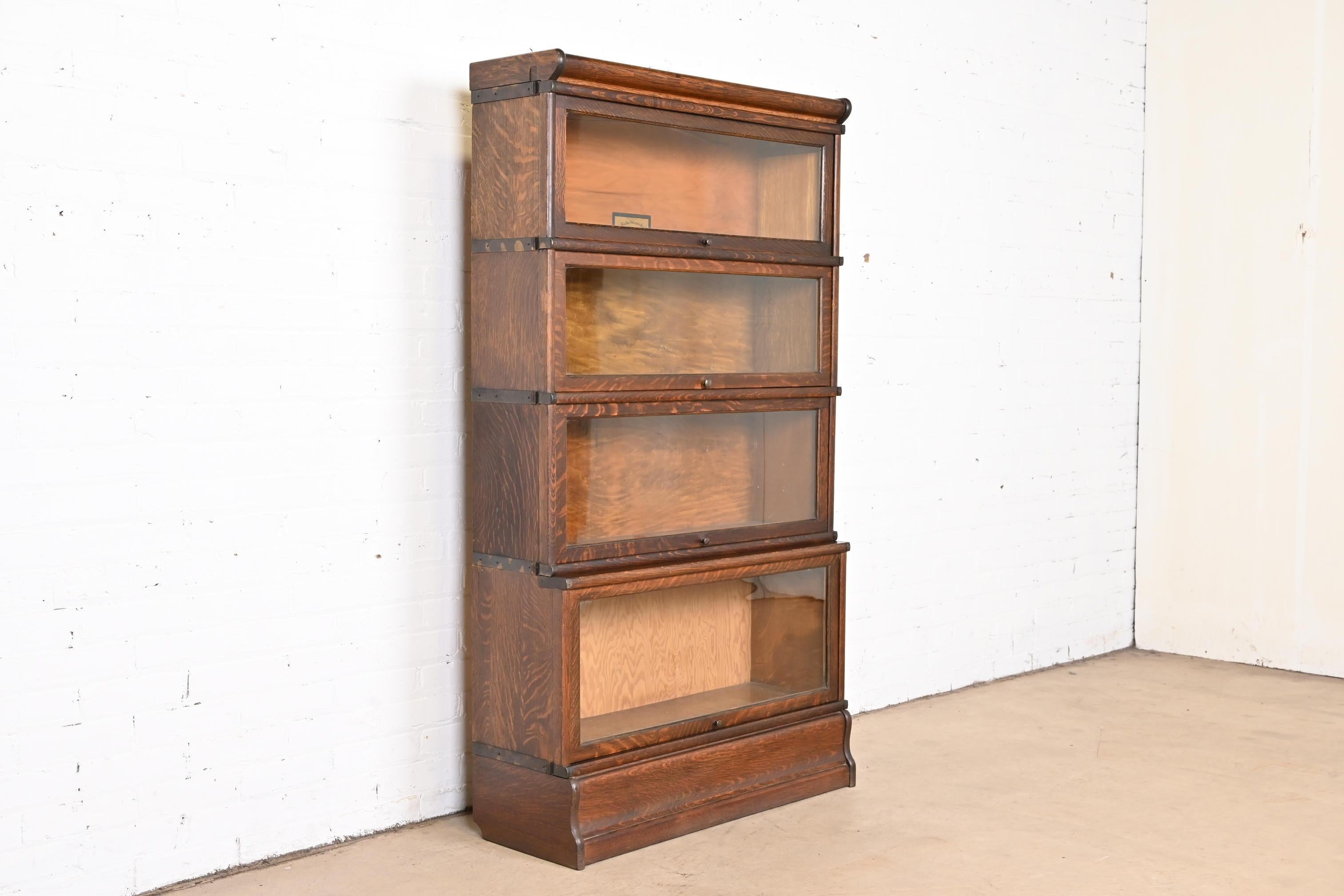 A gorgeous antique Arts & Crafts four-stack barrister bookcase

By Globe Wernicke

USA, circa 1920s

Beautiful quarter sawn oak, with glass front doors and original brass hardware.

Measures: 34