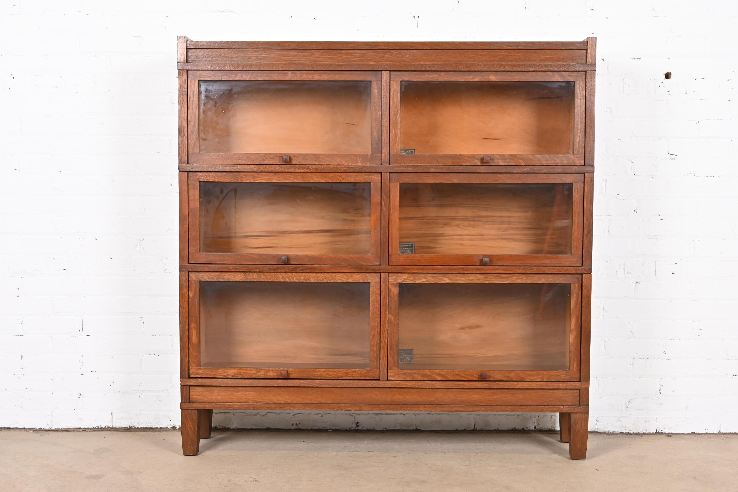 A rare antique Mission or Arts & Crafts double barrister bookcase 

By Globe Wernicke

USA, Circa 1900

Quarter sawn oak, with glass front doors.

Measures: 50.75