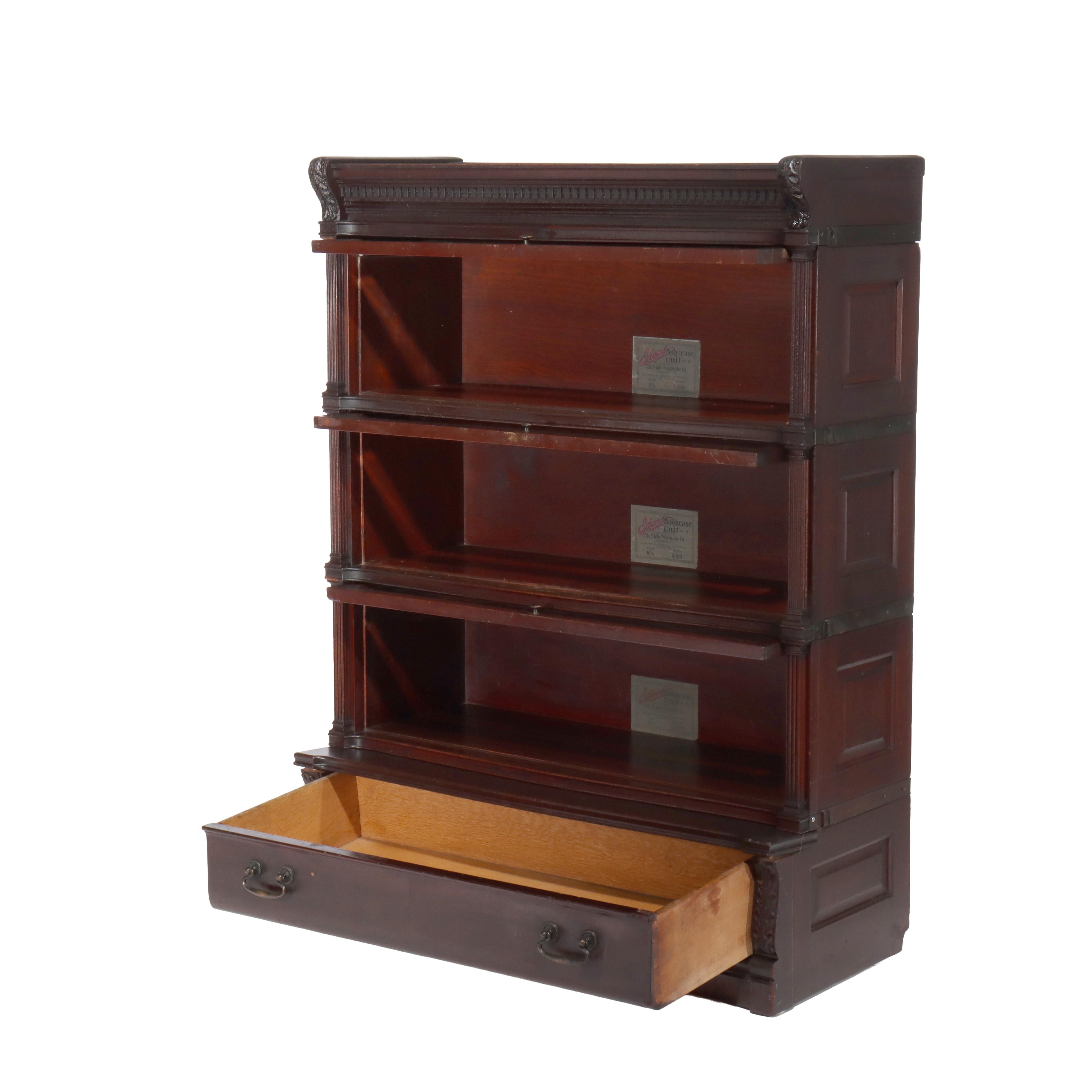 ***Reduced In-House Delivery Rates - Click on “Ask Seller” to Request a Quote***
Antique Globe Wernicke Carved Mahogany Three Stack Barrister Bookcase with Step Back Drawer & Beveled Glass Signed C1920.   
Measures - 46