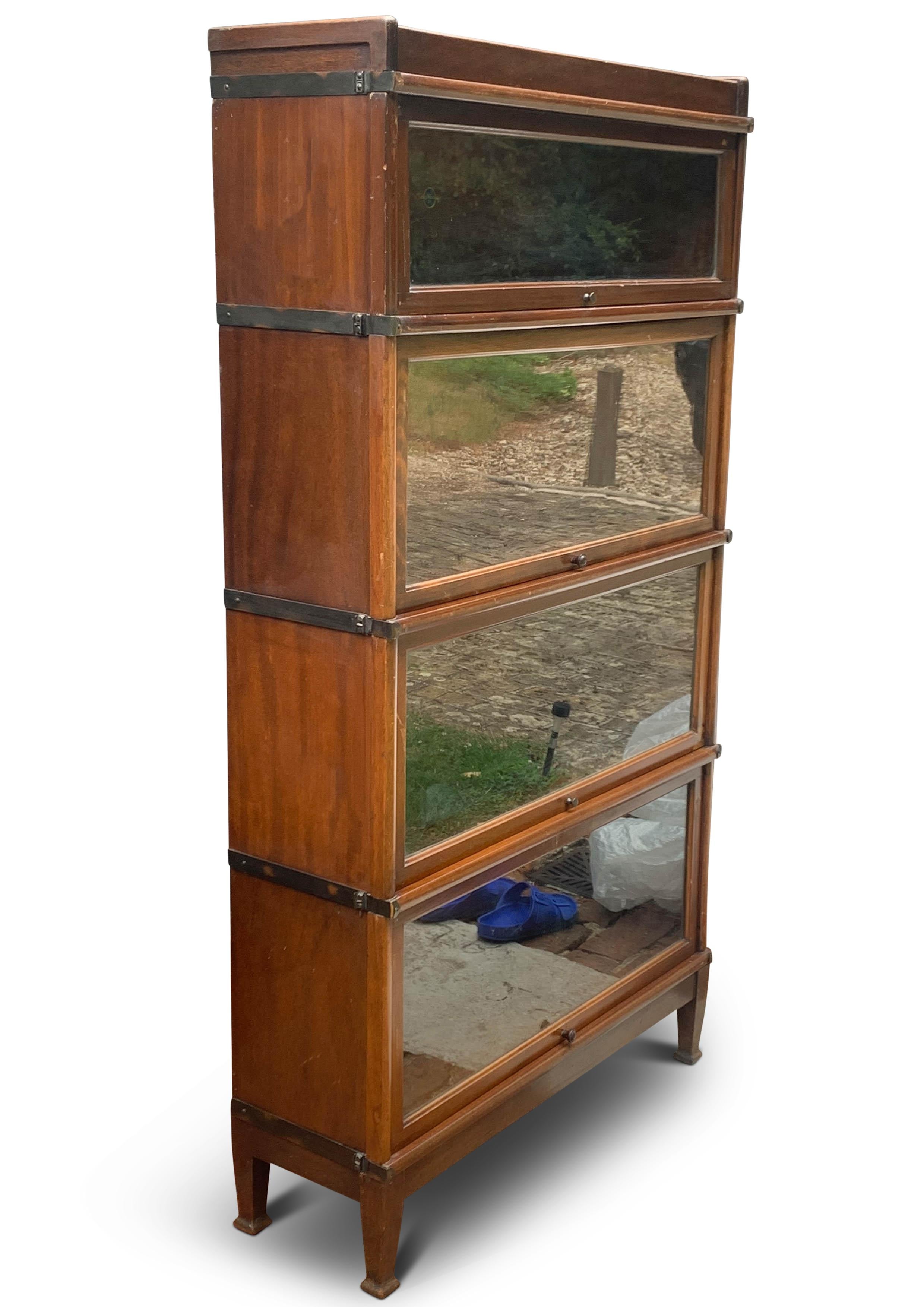 An Antique Globe Wernicke Four Section Iron Banded Glazed Stacking Barrister's Bookcase 1920s

Comes apart in sections for easy transportation.

Globe-Wernicke was formed as a result of the Cincinnati based Globe Files Company (est. in 1882)