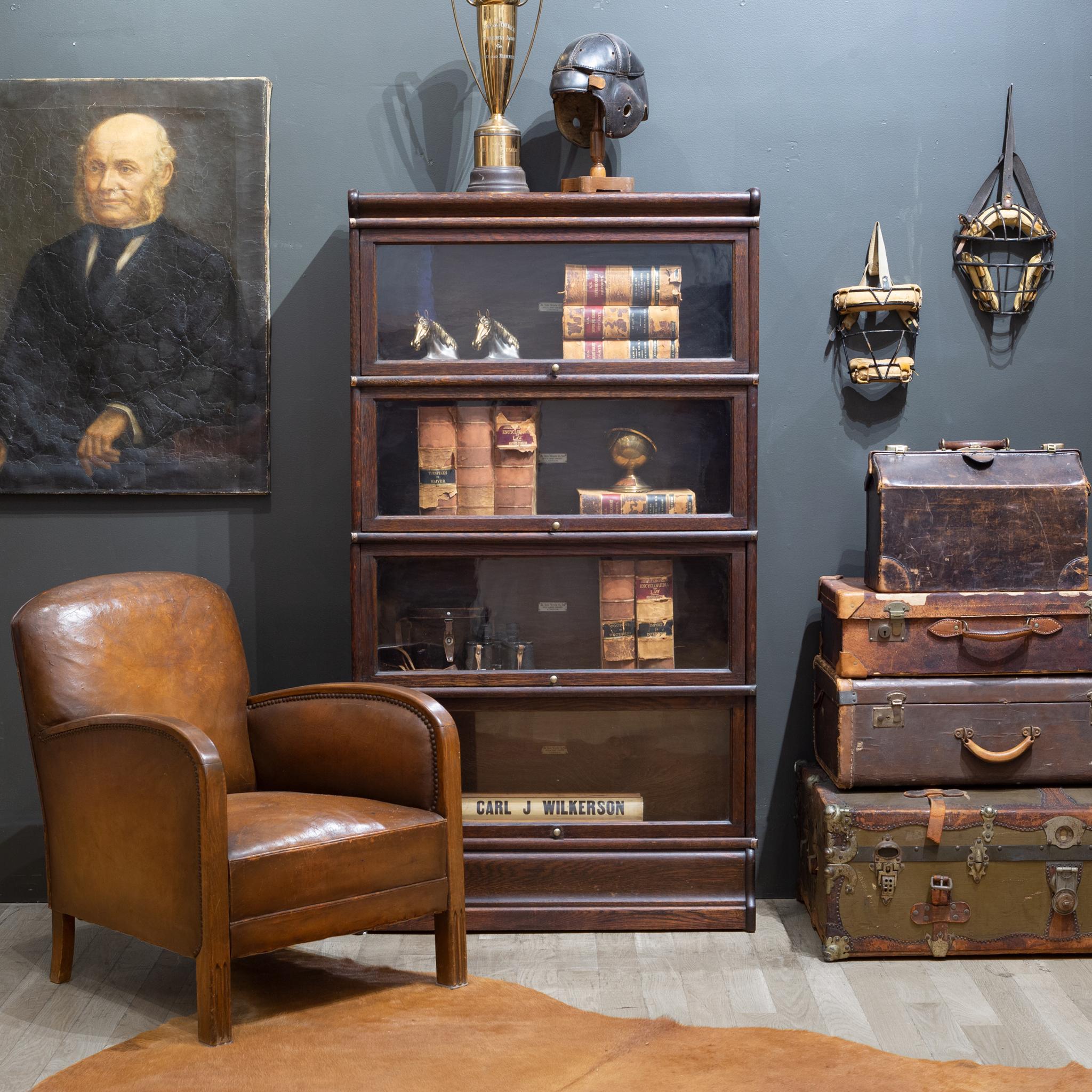 About

An original late 19th/early 20th century 4 stack Oak lawyer's bookcase with a Mahogany finish and brass knobs. All glass is original. The doors all open and slide in properly.

The whole piece is modular consisting of 6 pieces: the top, the