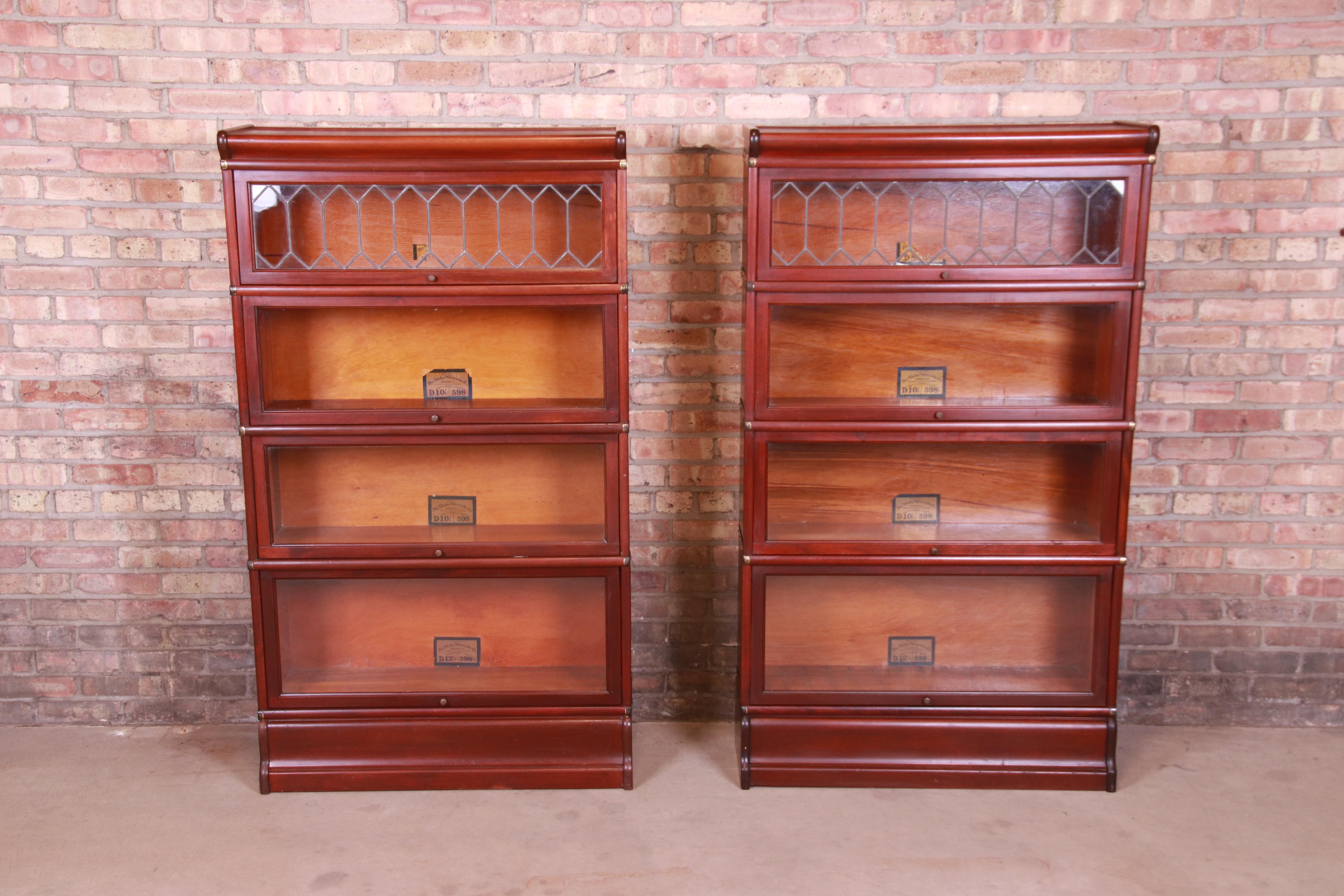 An outstanding pair of antique Arts & Crafts four-stack barrister bookcases

By Globe Wernicke

USA, circa 1920s

Mahogany, with leaded glass doors and brass hardware.

Measures: 34