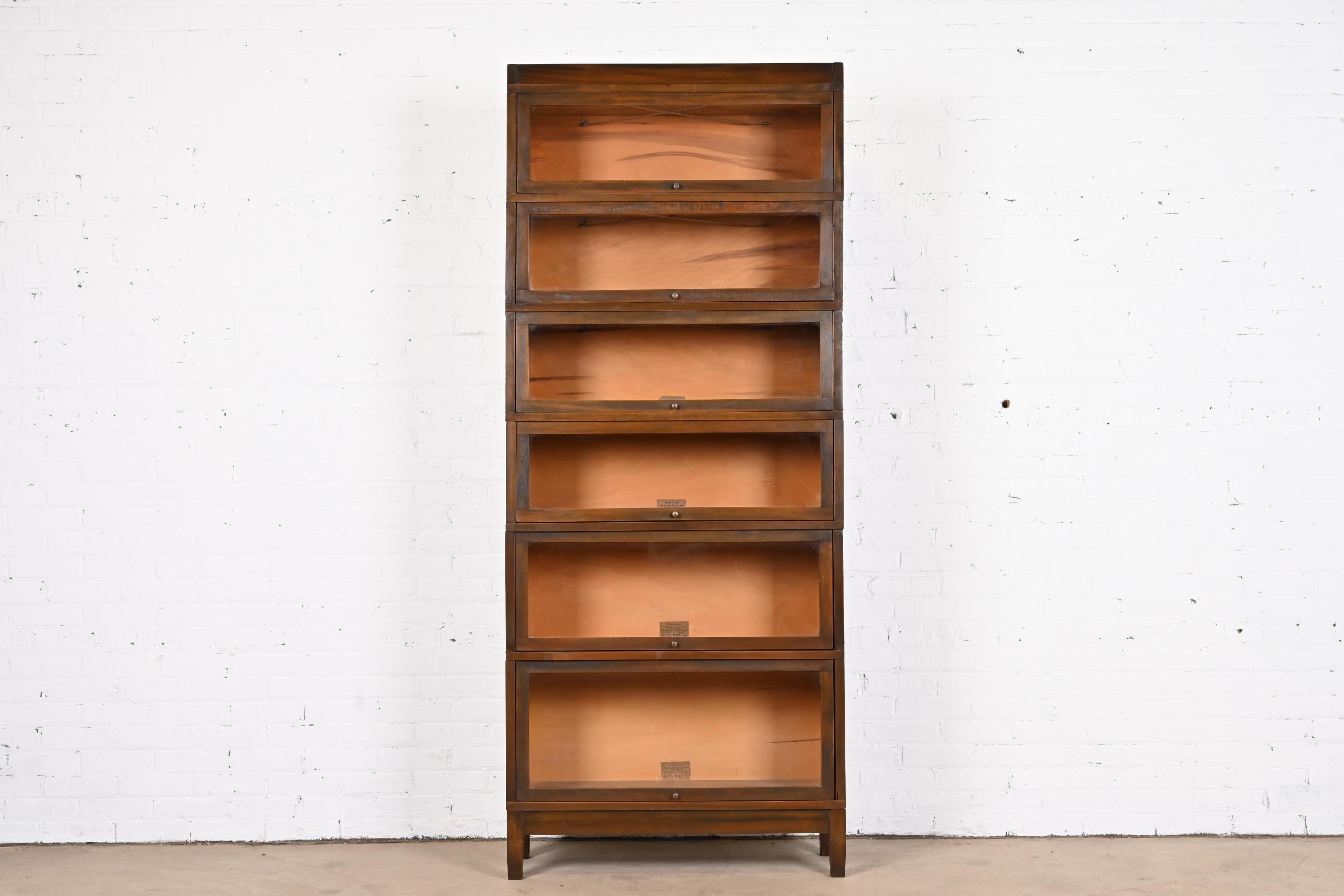A gorgeous antique Arts & Crafts six-stack lawyer bookcase

By Globe Wernicke

USA, Circa 1890s

Mahogany, with glass doors and brass hardware.

Measures: 34.25