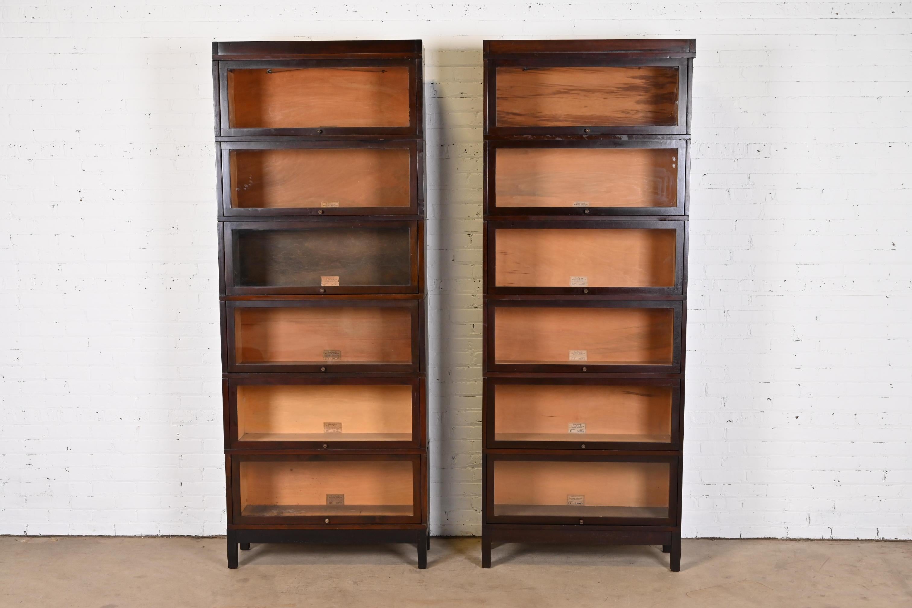 A gorgeous pair of antique Arts & Crafts six-stack lawyer bookcases

By Globe Wernicke

USA, Circa 1890s

Mahogany, with glass doors and brass hardware.

Measures: 33.75
