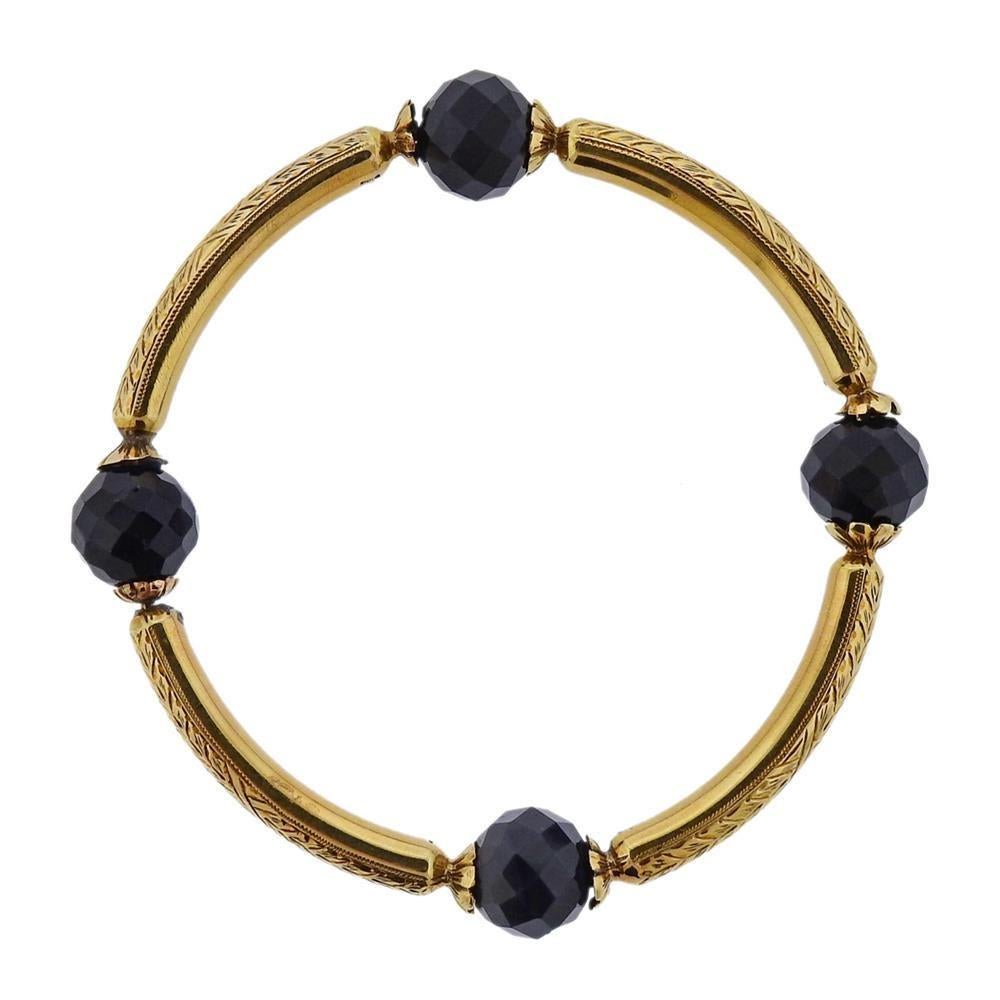 14k gold antique bangle bracelet. Measures 71mm inner diameter x 5.7mm wide. Weights 32.6 grams. Agate has a small chip, one is mismatched in color. Marked with gold Hallmarks.
