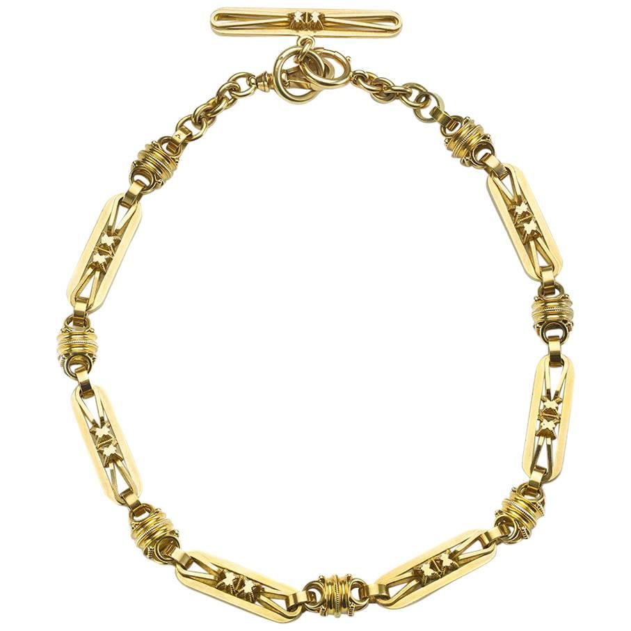 An antique gold Albert chain, with three dimensional long oval and barrel shaped links. This can be converted to a necklace, Circa 1870.