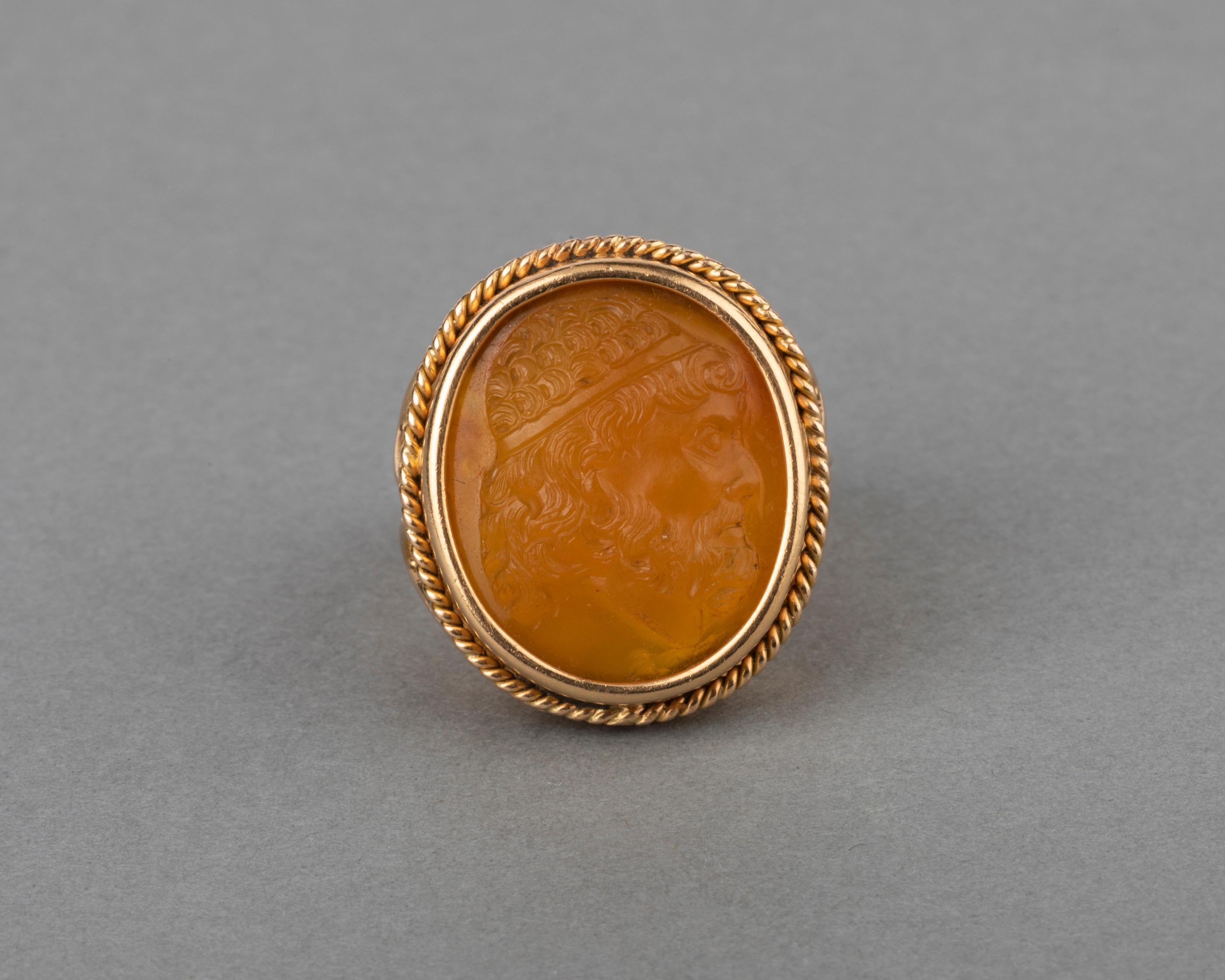 Antique Gold and Agate Cameo Ring

The Cameo is very beautiful, it represent the prowl of an antique man profile.
The ring is made in gold 18k.
The cameo measures 21*17mm.   The stone is Agate.
I think the ring was made in the 1950's but the cameo