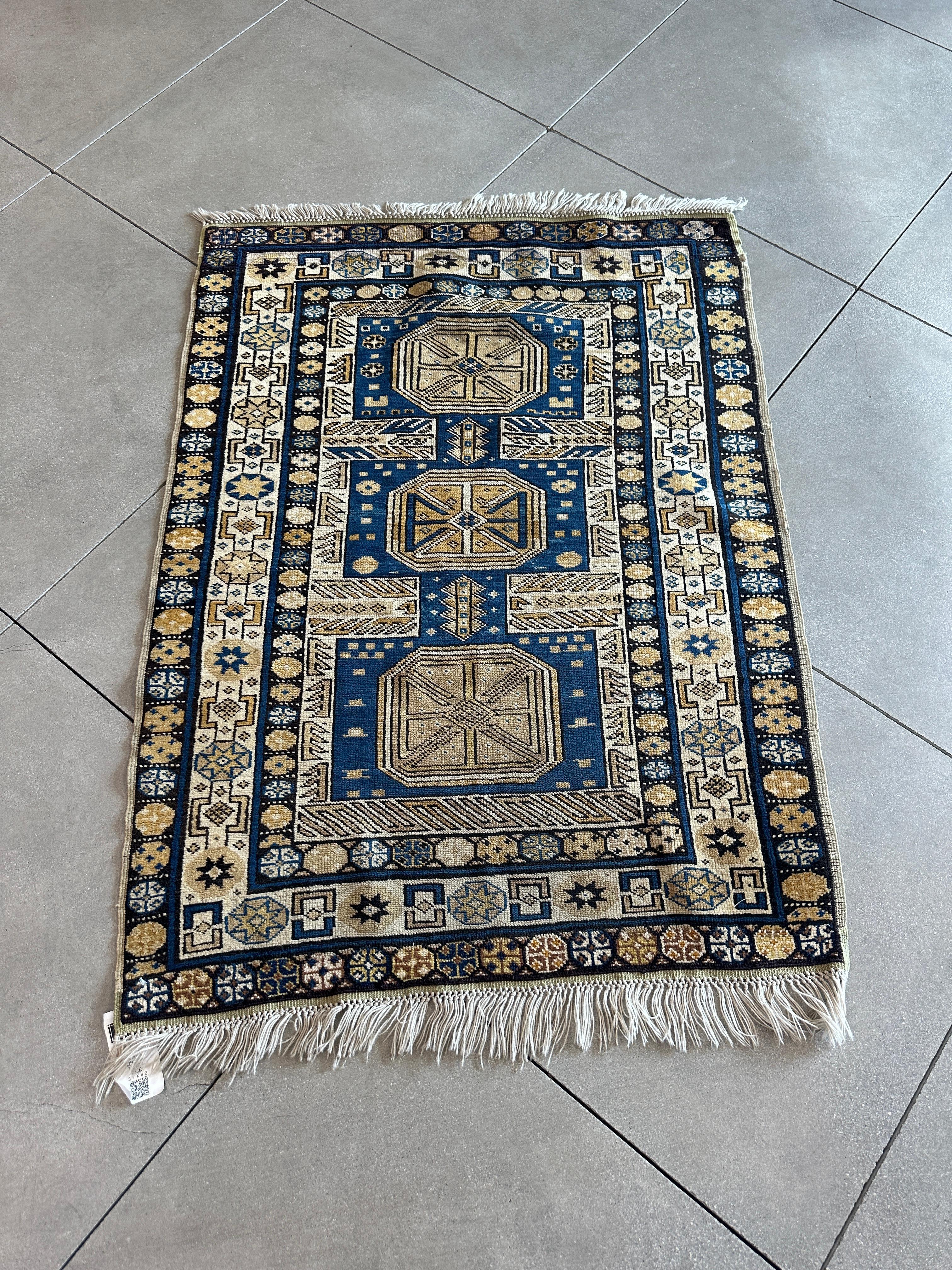 Enrich your home with the luxurious elegance of our Old Gold and Blue Turkish Wool Rug. This exquisite piece showcases the artistry and cultural heritage of Turkish craftsmanship, featuring a captivating blend of gold and blue hues. Perfect for