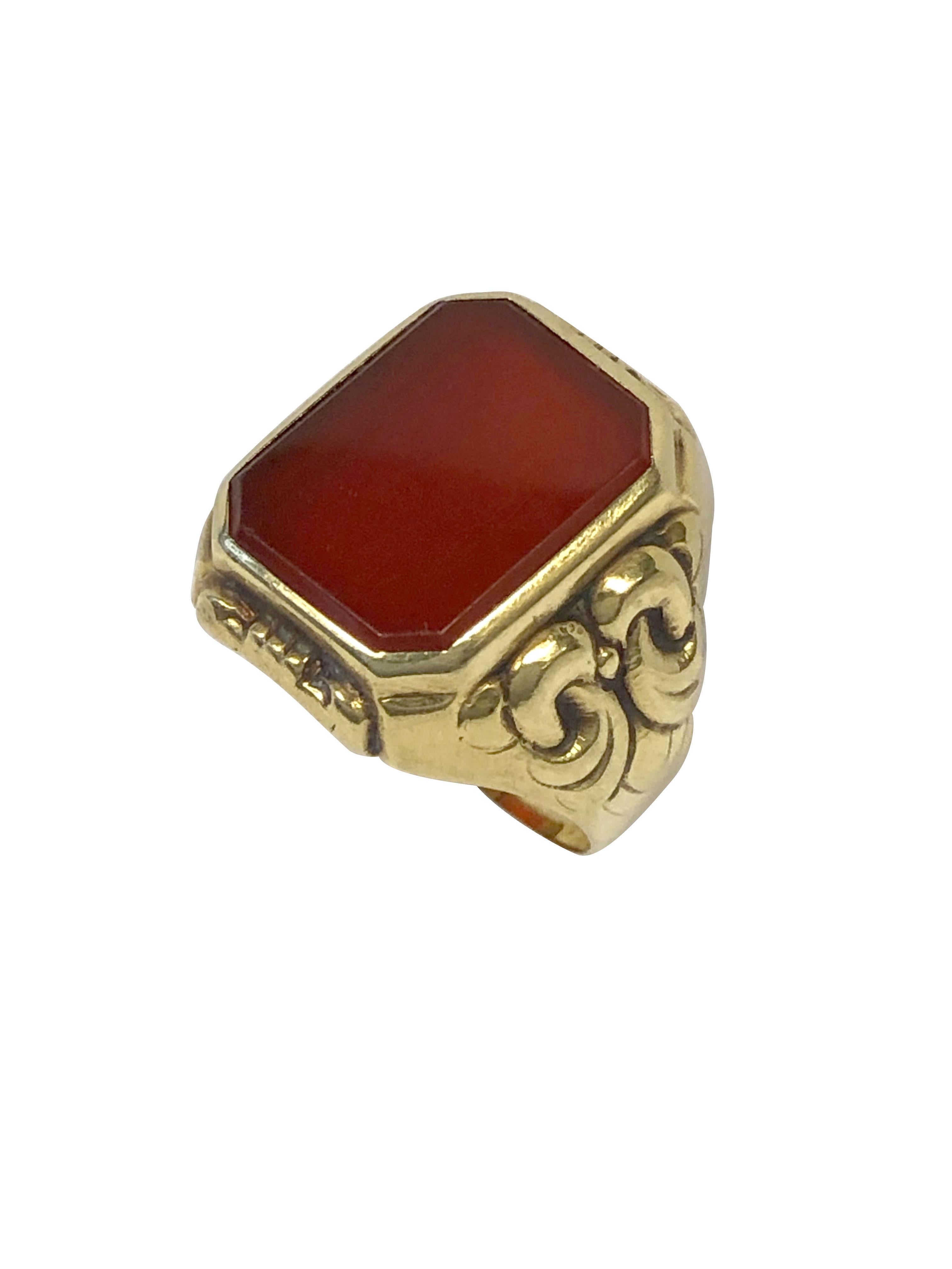 Circa 1920 European 14k Yellow Gold Signet Ring, centrally set with a Carnelian, the top of the ring measures 5/8 X 5/8 inch, finger size 6. 