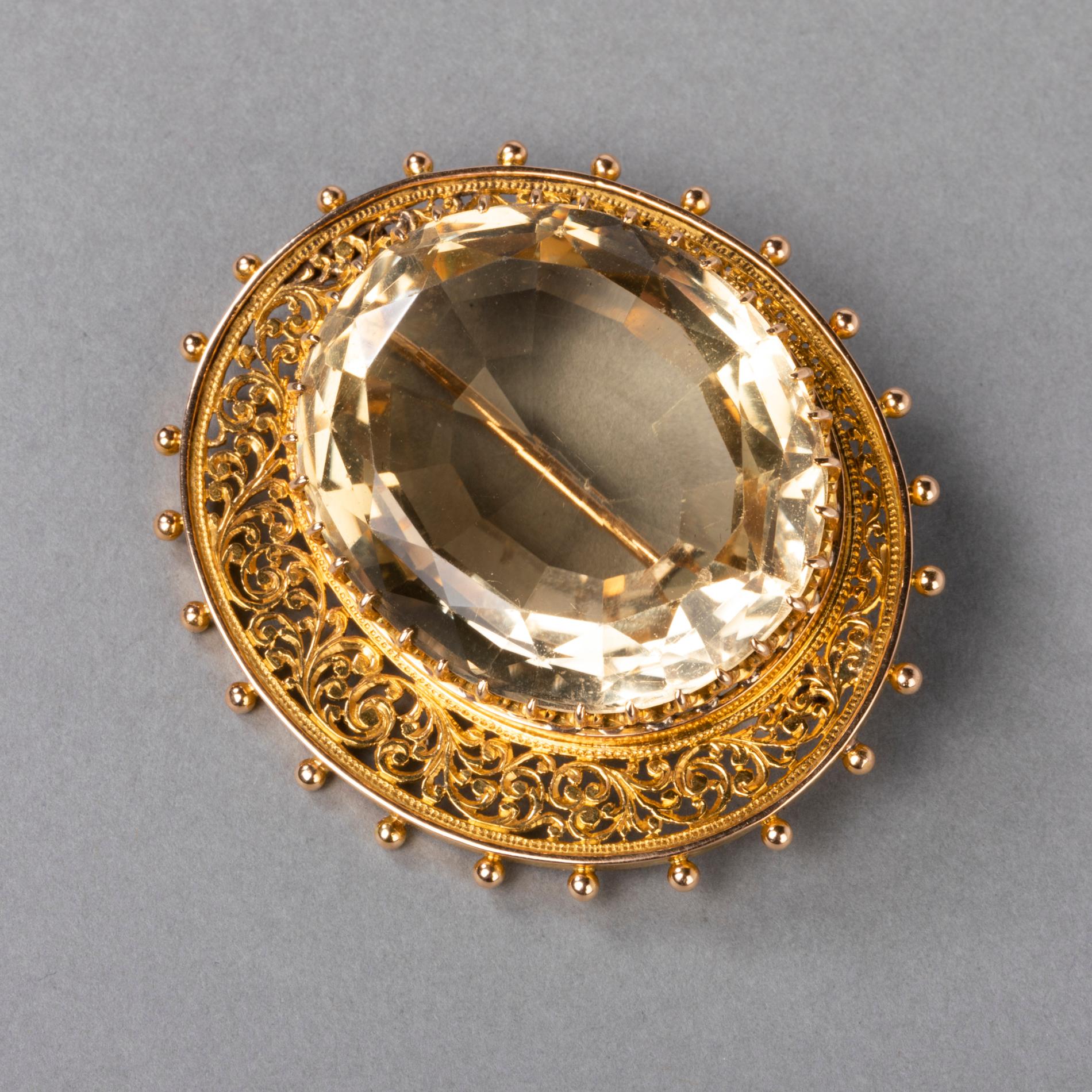 Very beautiful antique brooch, 19th century French made. 
Made in yellow gold 18k and set with a big citrine. The brooch is heavy, 25.70 grams.
Eagle head mark for gold 18k.
The citrine measures 32*25 mm. 
The brooch measures 4.5 cm * 4 cm.