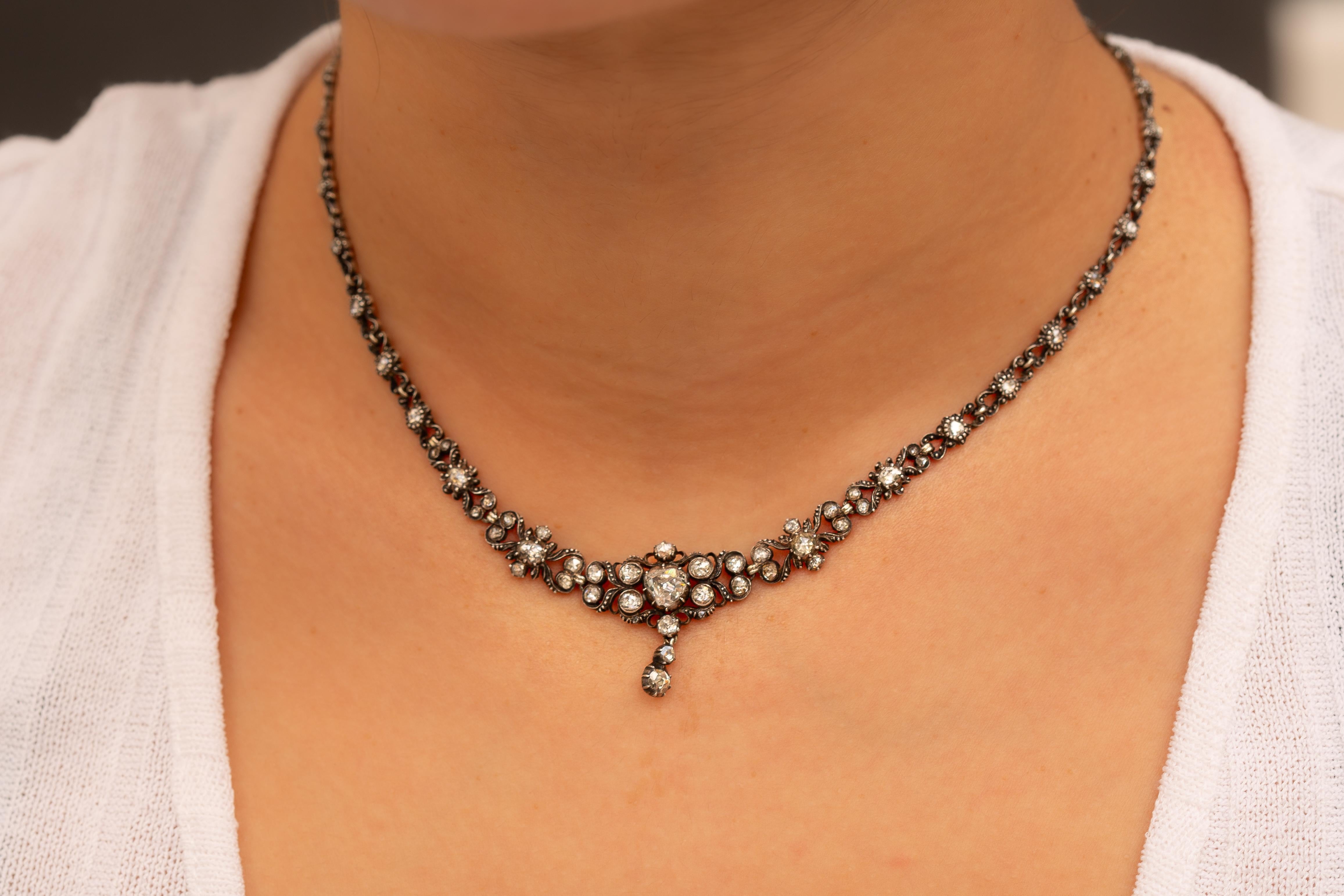 This remarkable vintage necklace, crafted in the Netherlands circa 1900, features a total of 69 rose-cut diamonds, all set in silver foil-backed mounts. 

At the heart of the design is a superb diamond drop element, its central rose-cut diamond