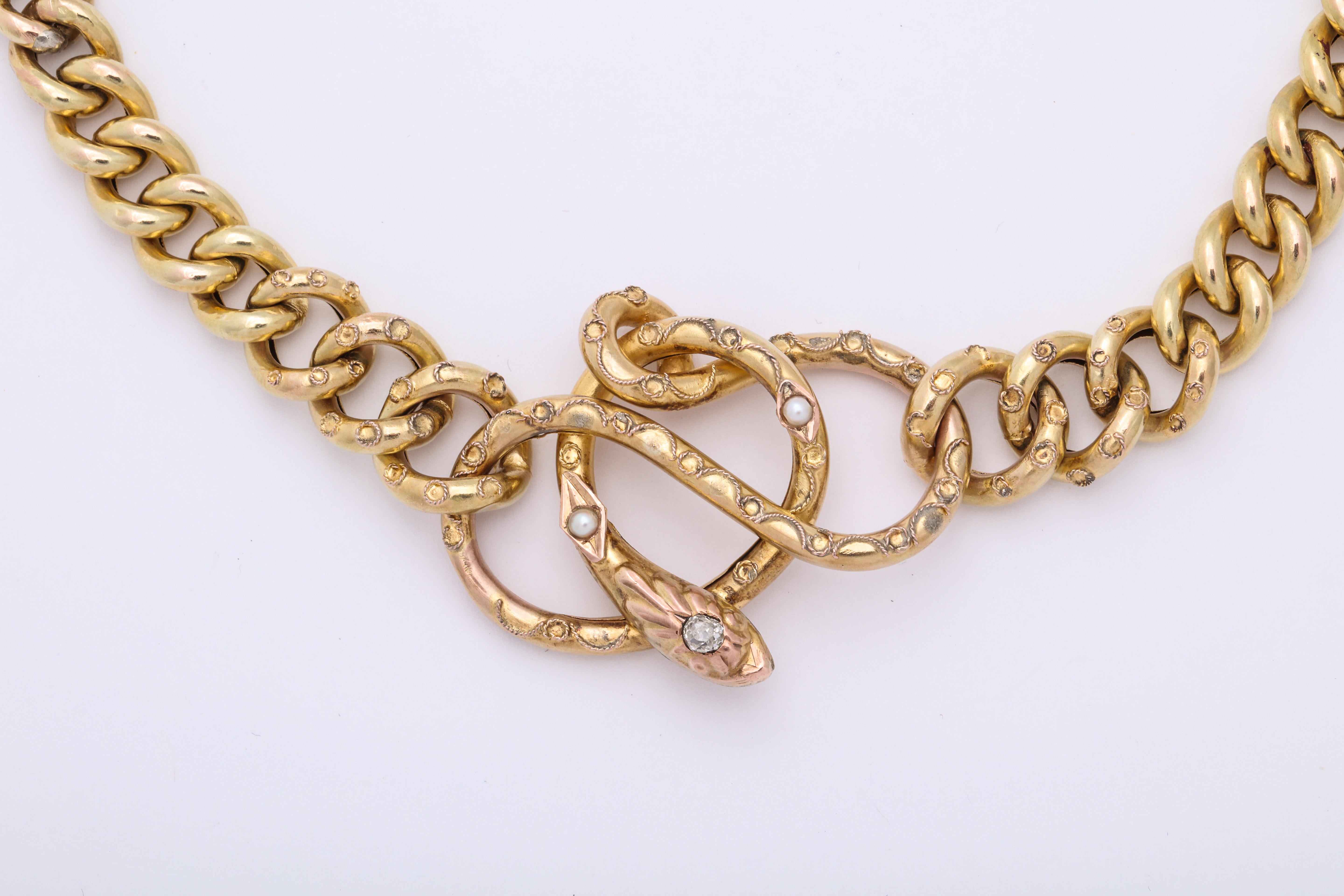 A great Antique snake necklace in 14 kt gold with diamond and pearls . The necklace can be reduced to make a bracelet 