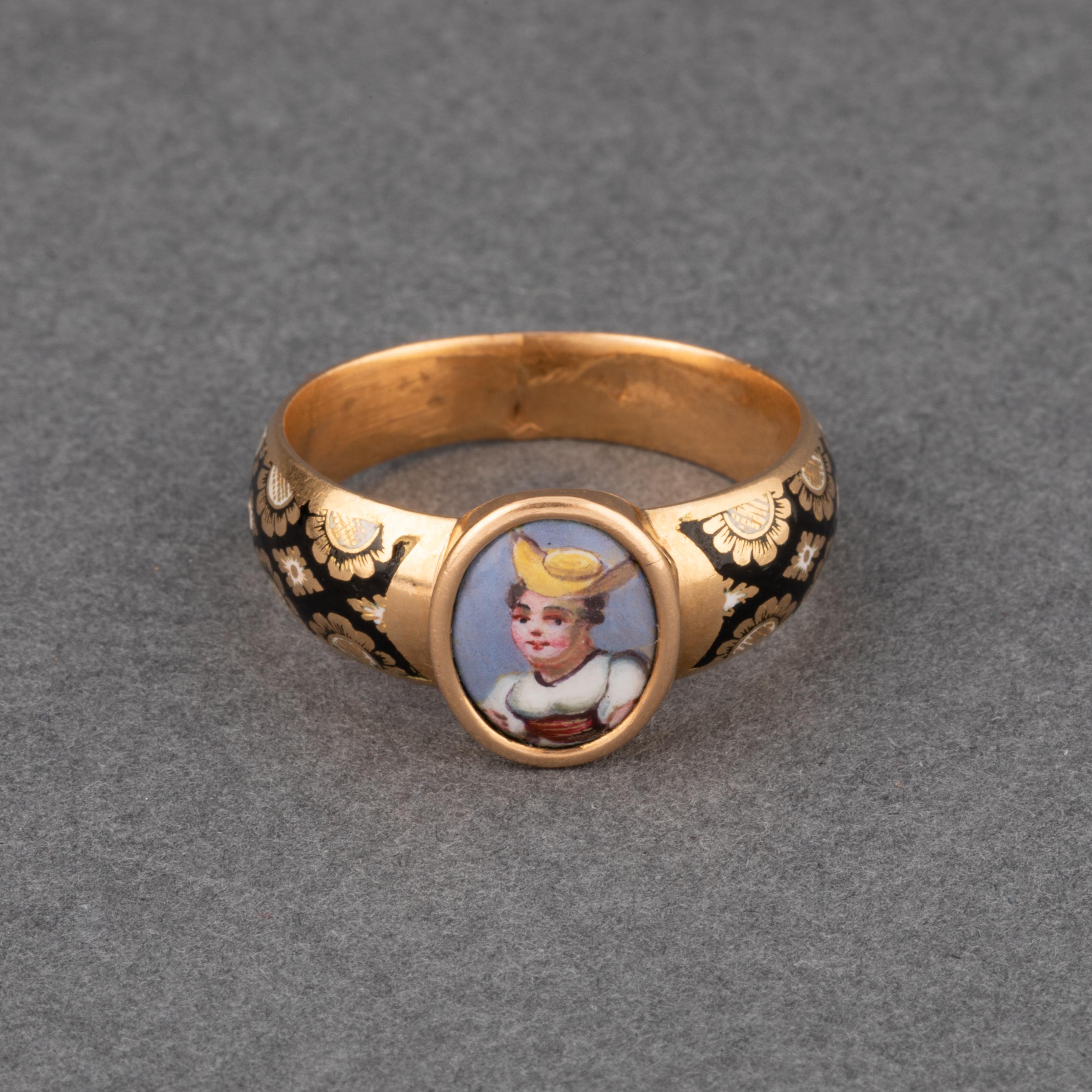 One rare and beautiful antique ring, made in early 19th century, European made.
Made in yellow gold 18k and painted enamel. The ring has a secret compartment that can be revealed by opening the front middle part.
The ring size is 60 or 9.2