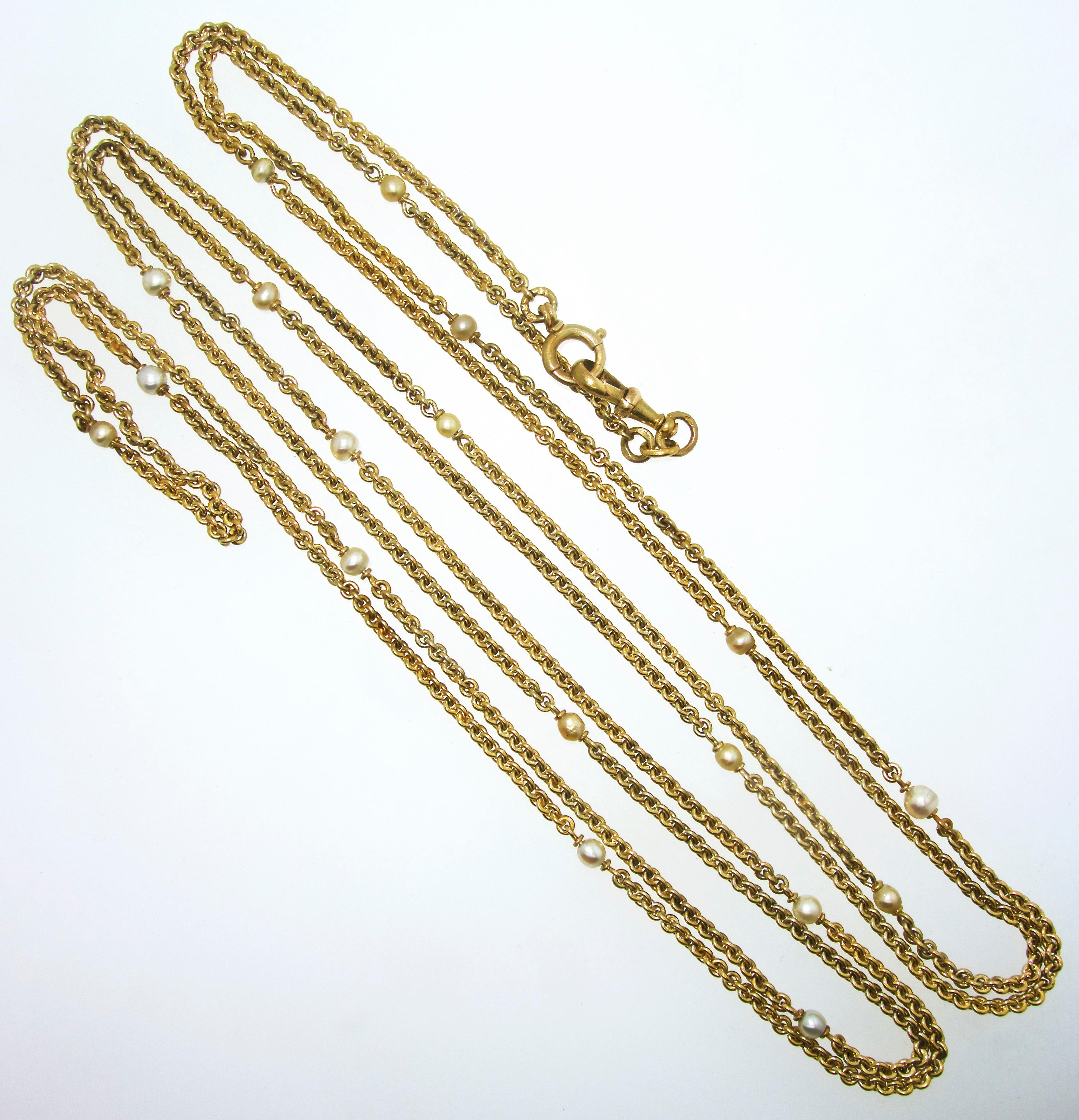 Antique gold handmade chain, late 19th century, interspersed with natural pearls.  This well made piece has 18 natural pearls.  The chain weighs 64.5 grams and is over 70 inches long.  Circa 1890