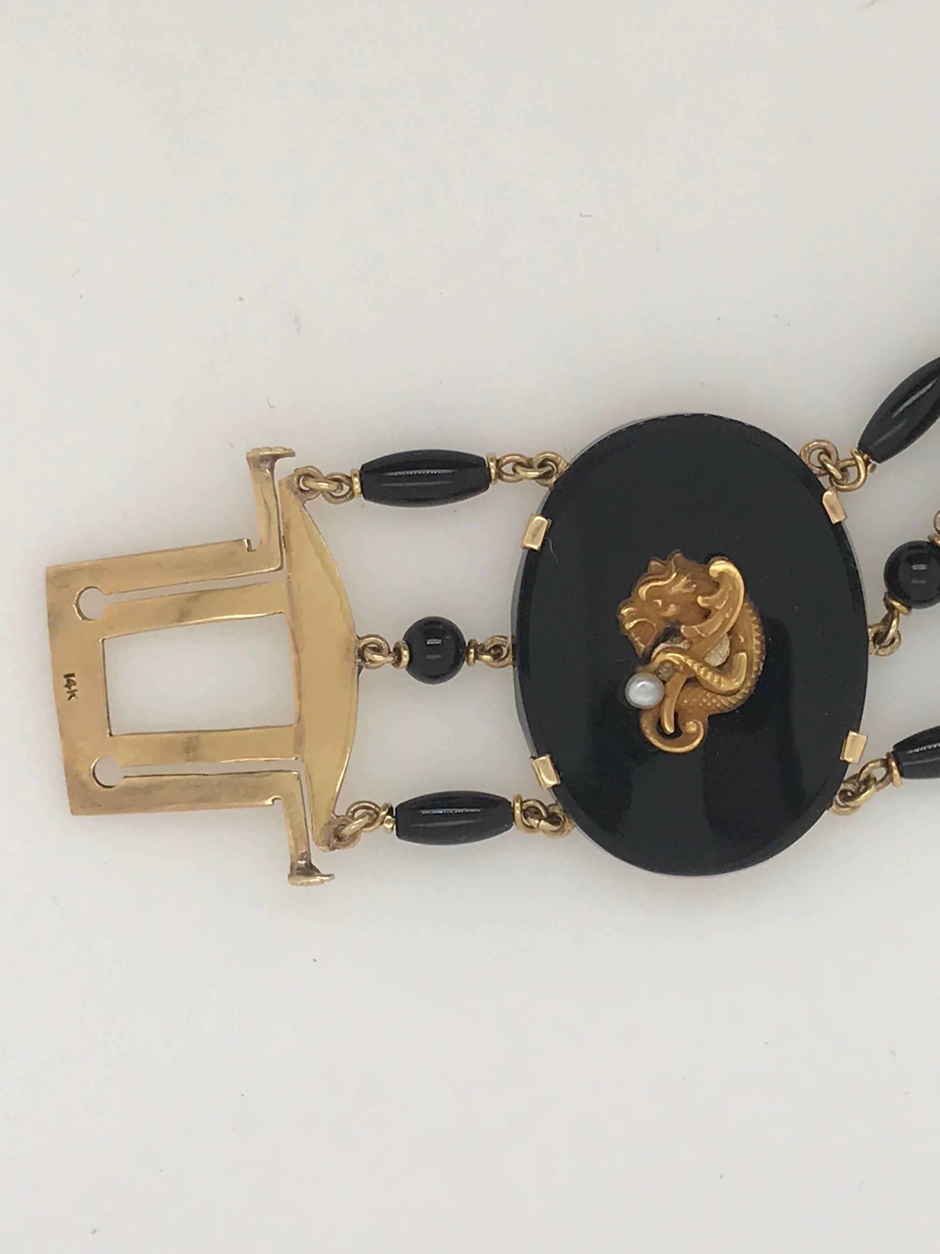 Antique Gold and Onyx Bracelet with Pearl and Emerald Accents In Excellent Condition For Sale In New Orleans, LA