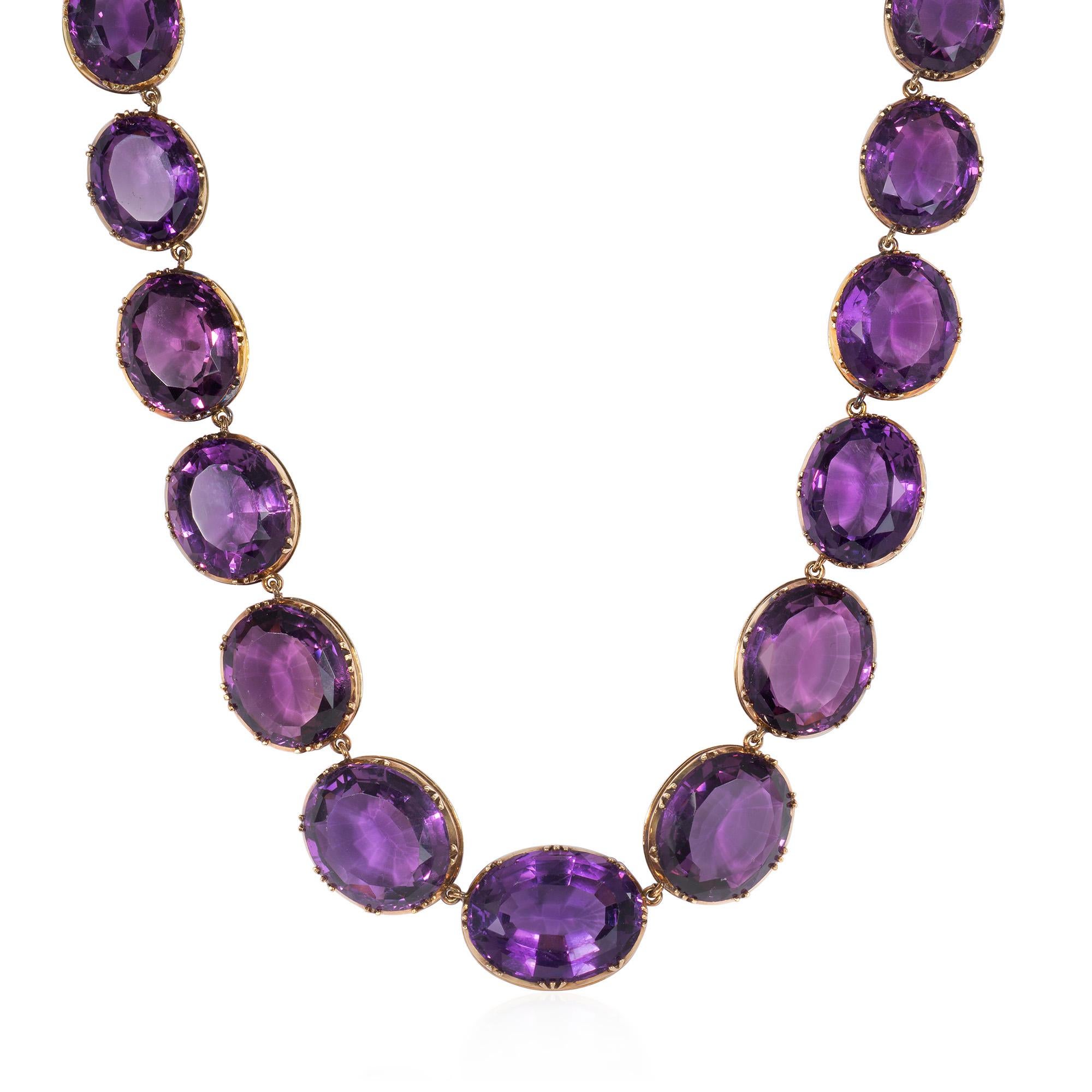 An antique Victorian period gold and amethyst rivière necklace comprised of graduated oval amethysts in open bezel settings, in 18k.  Stones measure approximately 22.50mm x 17.00mm to 15.50mm x 13.00mm

Please do not hesitate to request photos of