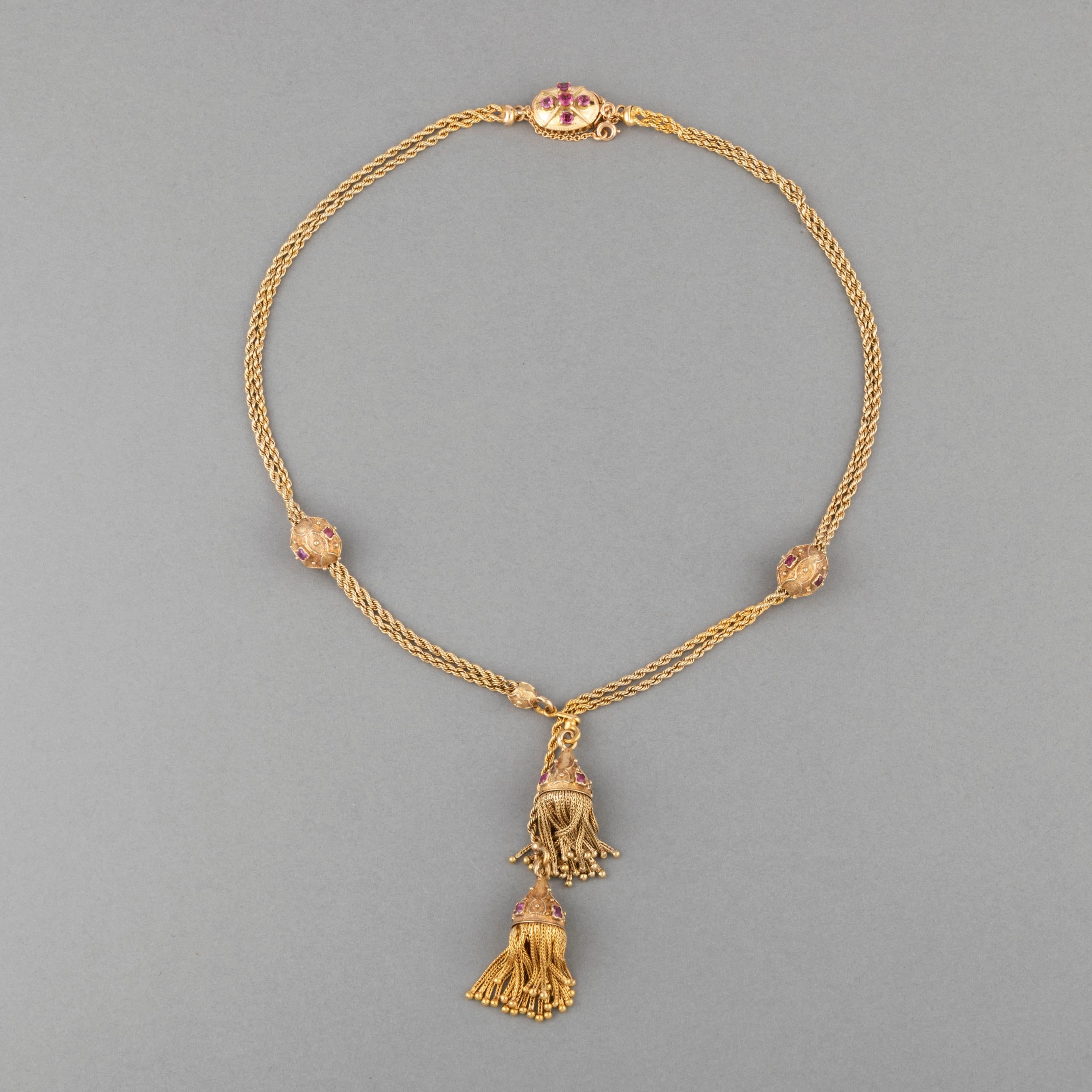 Antique Gold and Rubies French Pompon necklace

Very lovely antique necklace, french made circa 1880.
Made in yellow gold 18k and set with rubies. The craft is quality. The ripe and pompon design is elegant.
The length is 41 cm or 16.4 inches.
Total
