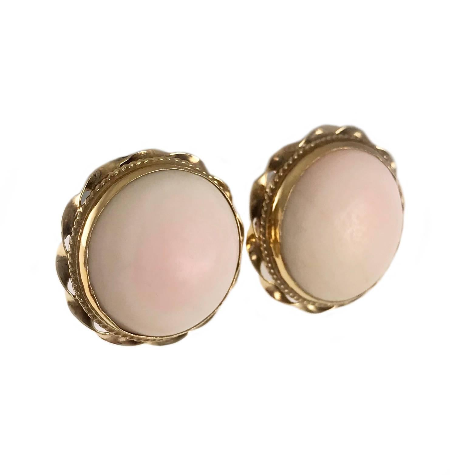 Antique 14k Yellow Gold Pink Coral Earrings, Angel Skin/Pink Blush Coral. Lovely and delicate Angel Skin Coral 15mm round cabochon earrings with twisted gold rope detail wrapped around bezel and screw back closure. A touch of pink hue makes these