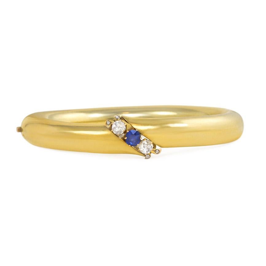 An antique gold tubular bangle bracelet centrally set with a sapphire flanked by old mine cut diamonds, with rose diamond accents, in 14k.  Russia, Signed AS.  Atw 0.50 ct. old mine cut diamonds.

Inner circumference approximately 6.5