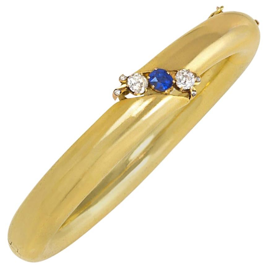 Antique Gold Bangle Bracelet with Central Diagonal of Diamonds and Sapphire For Sale
