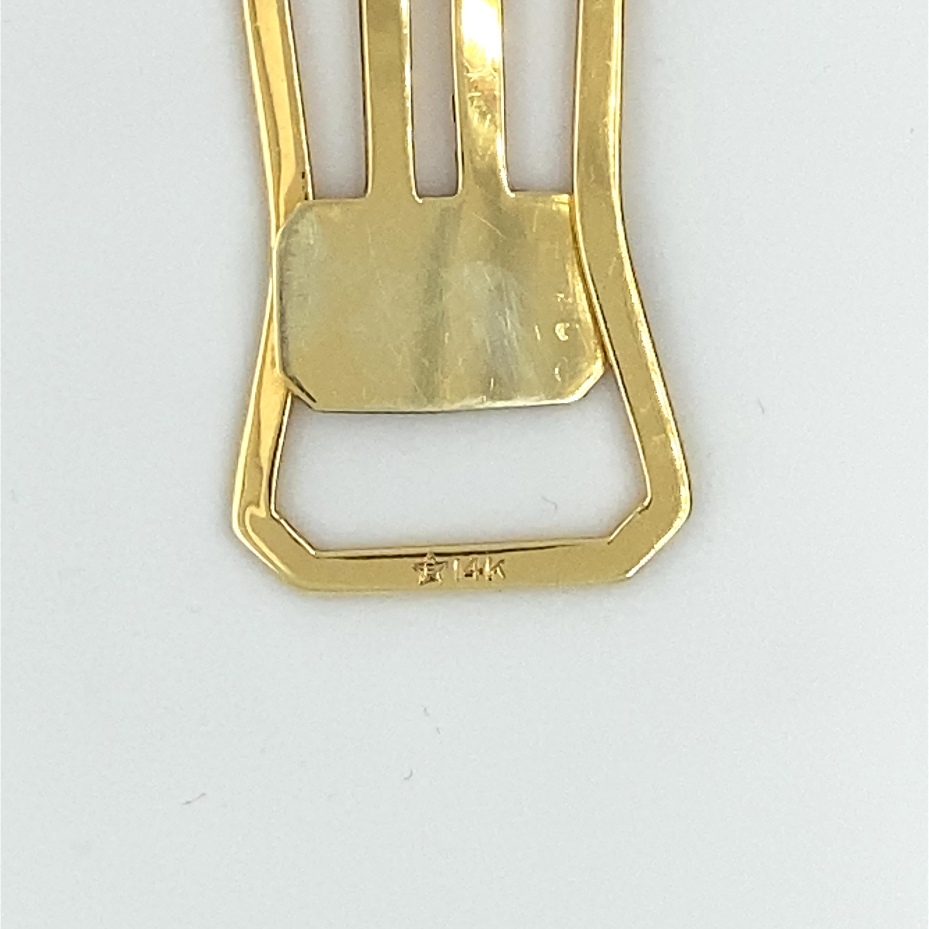 For the inveterate reader:  a 14K gold bookmark.  A geometric shape, that slips onto a page.  1 1/3