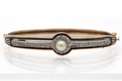 Antique gold bracelet with diamonds and pearl, decorated with enamel.