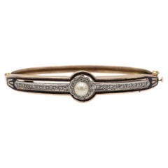 Antique gold bracelet with diamonds and pearl, decorated with enamel.
