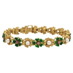 Antique gold bracelet with enamel, pearls and pink sapphires.