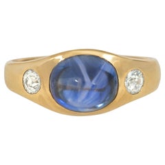 Antique Gold, Cabochon Sapphire, and Diamond Three-Stone Flush-Set Ring