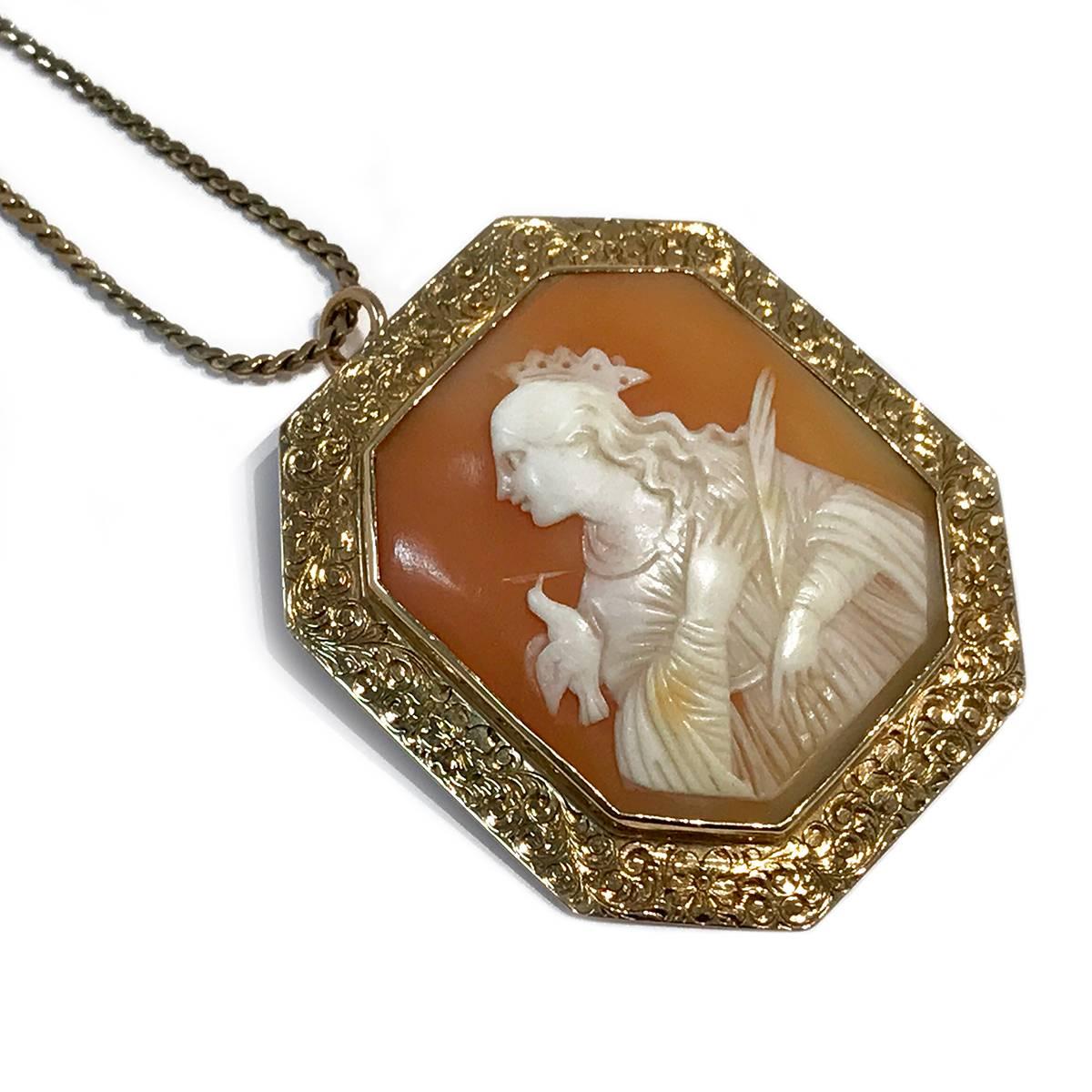 Antique 14k Yellow Gold Carved Shell Octagon Bezel Cameo Brooch Pendant with engraved filigree around bezel. Portrait of a lady holding a feather and a dove on her shoulder. The size of brooch pendant is approximately 43mm x 49mm. Brooch Pendant