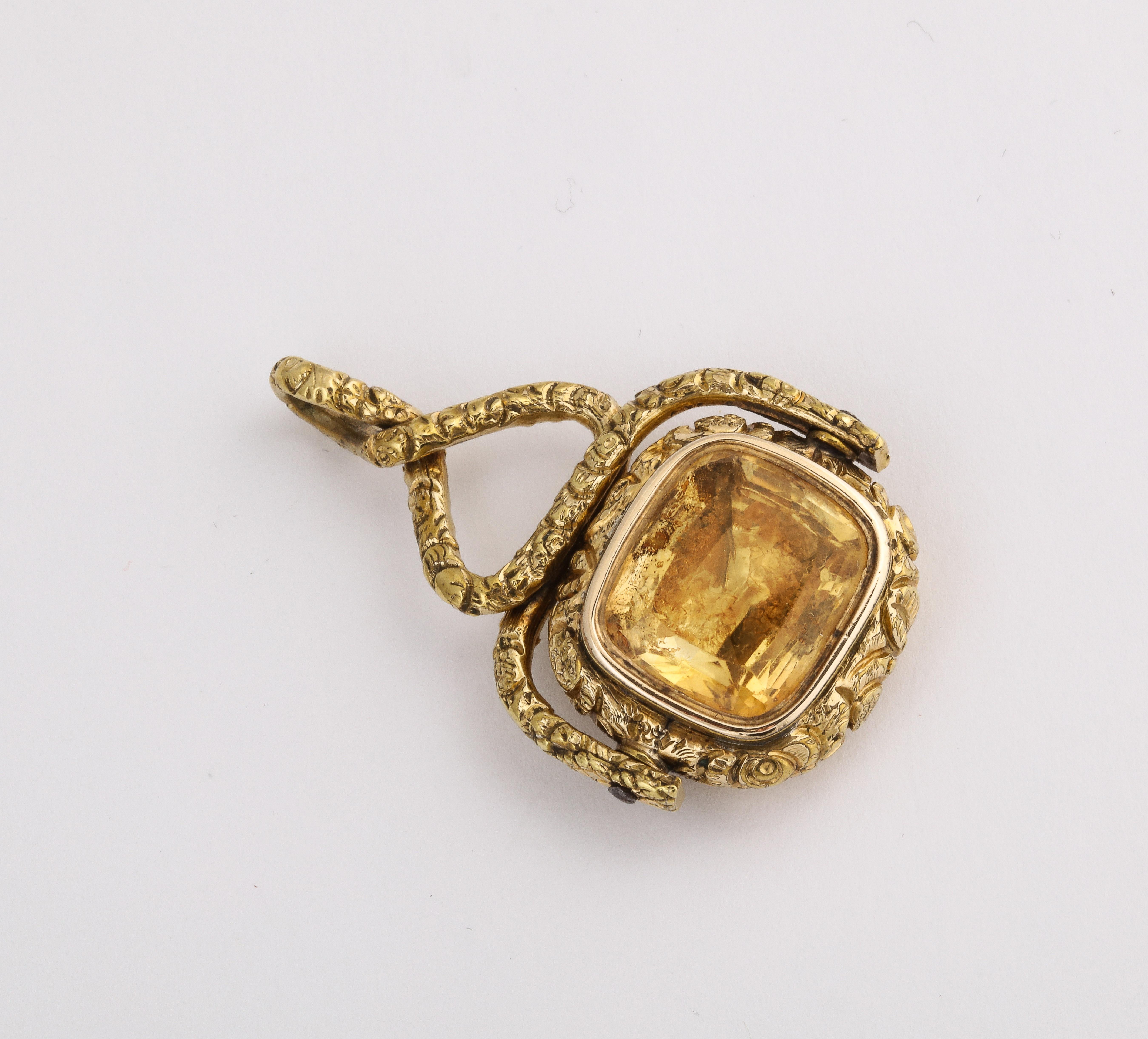 Have it your way with the Georgian Citrine Spinner Fob c. 1820-30.. The fob is gold cased. One side is gold in a cross hatched pattern, the hatching appearing as small leaves. The other is foiled sparkling citrine. The fob is in excellent condition.