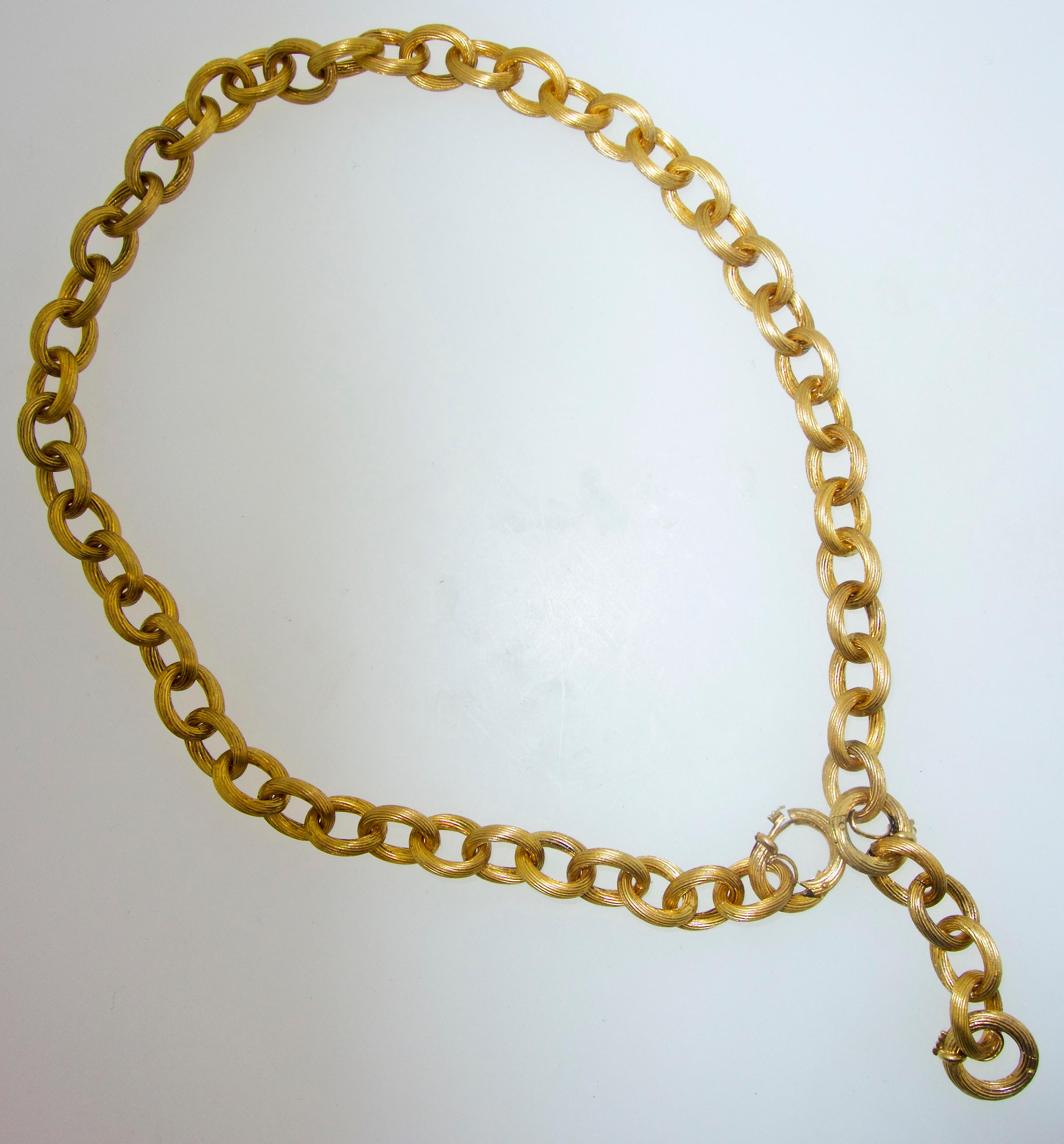 Antique  Victorian gold chain that can be worn several different ways.  The total length is 19 inches.  There is a two inch section that can be removed, or structured so that it can be a pendant chain.  This is a hand made link chain, probably