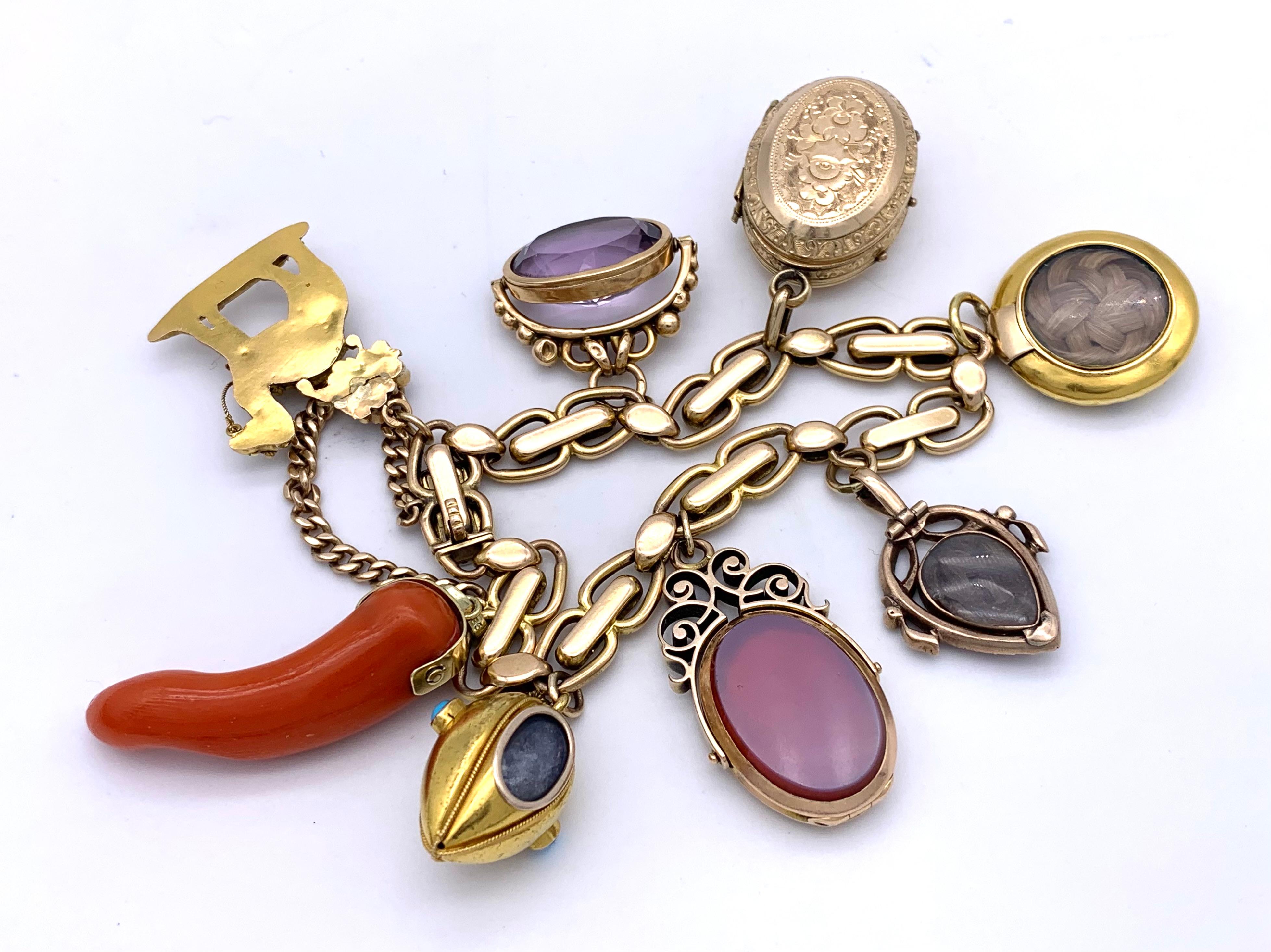 This extraordinary charm bracelet has a beautiful and unusual collection of  gold charms dating from 1780 through to the late 19th century.
A  garnet and pearl locket dating from 1780/85,  a wonderful Georg IV pendant designed as a gem set camel, a