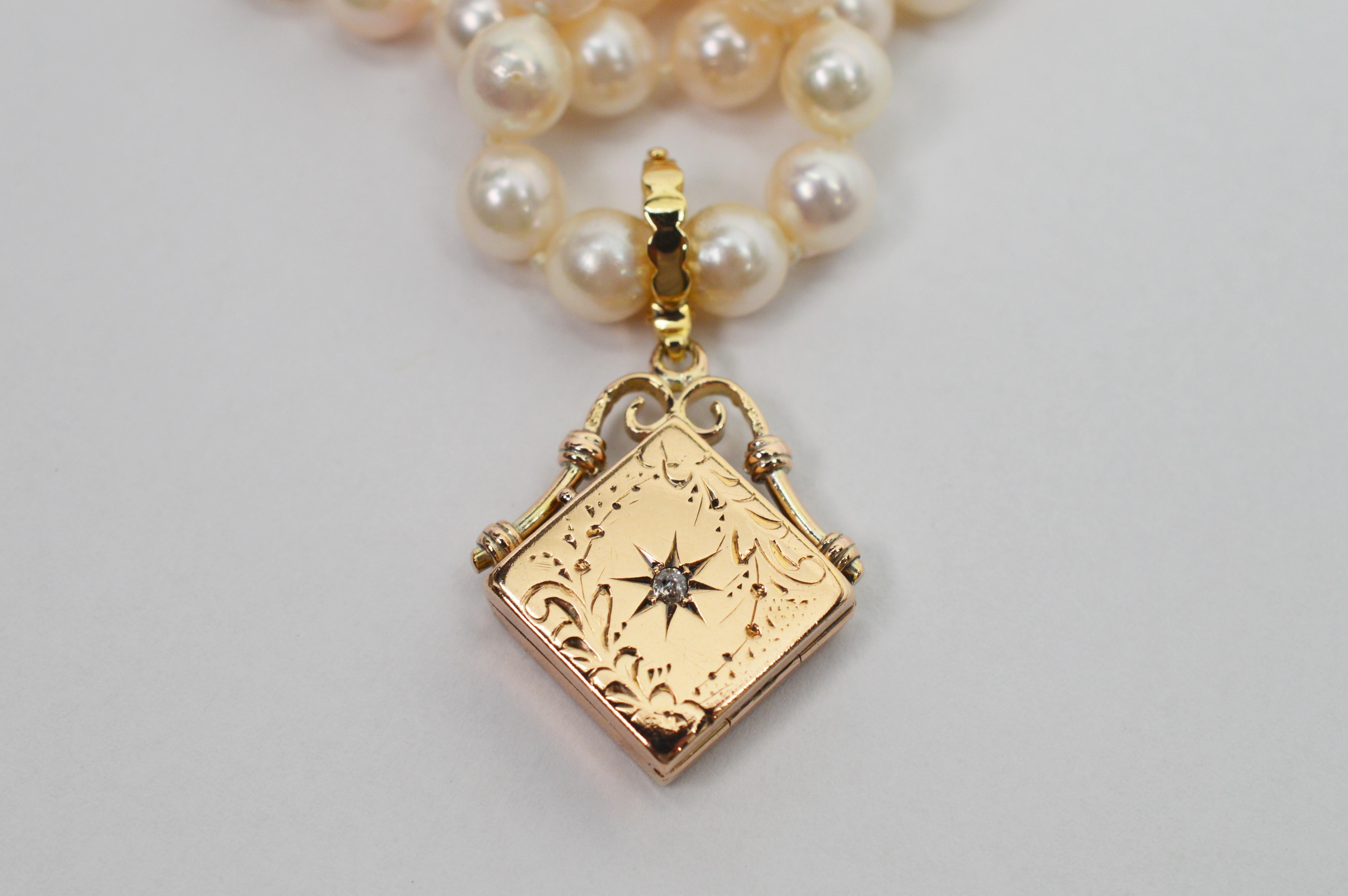 Timeless and romantic, this personalized antique fourteen karat gold charm enhancer elegantly sit as a pendant on a twenty four inch strand of creamy white 6 x 6.5 mm Akoya Pearls. The engraved charm with diamond accent is outfitted as an enhancer