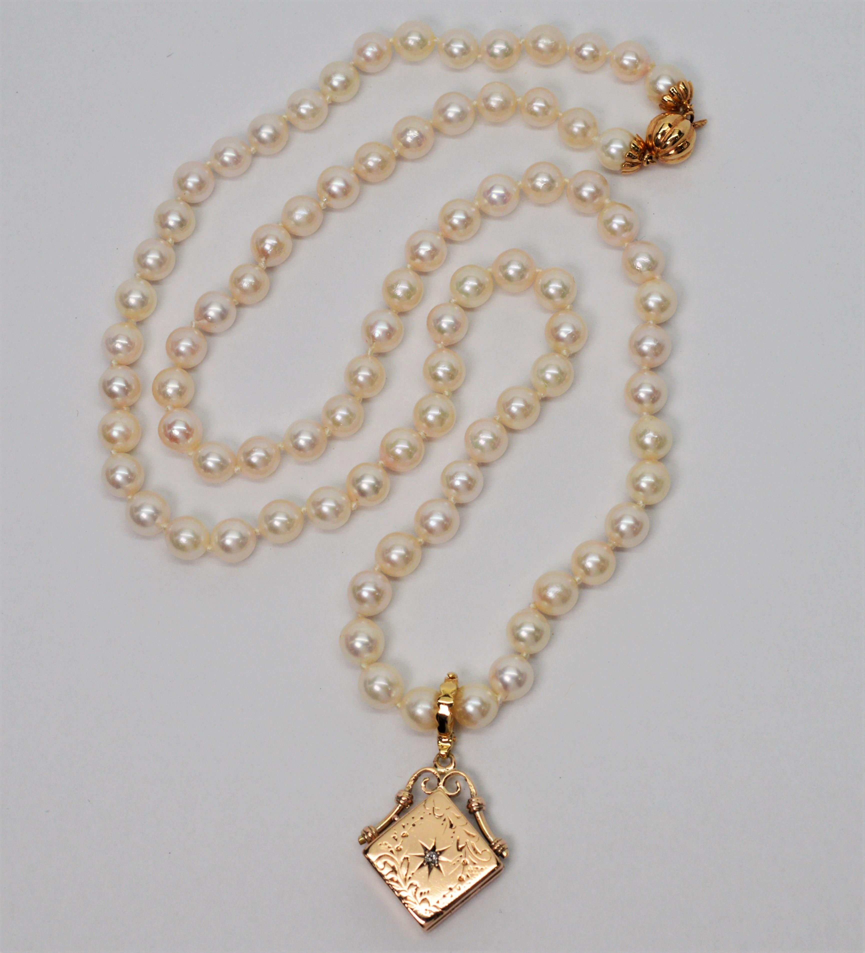 pearl necklace with gold charm