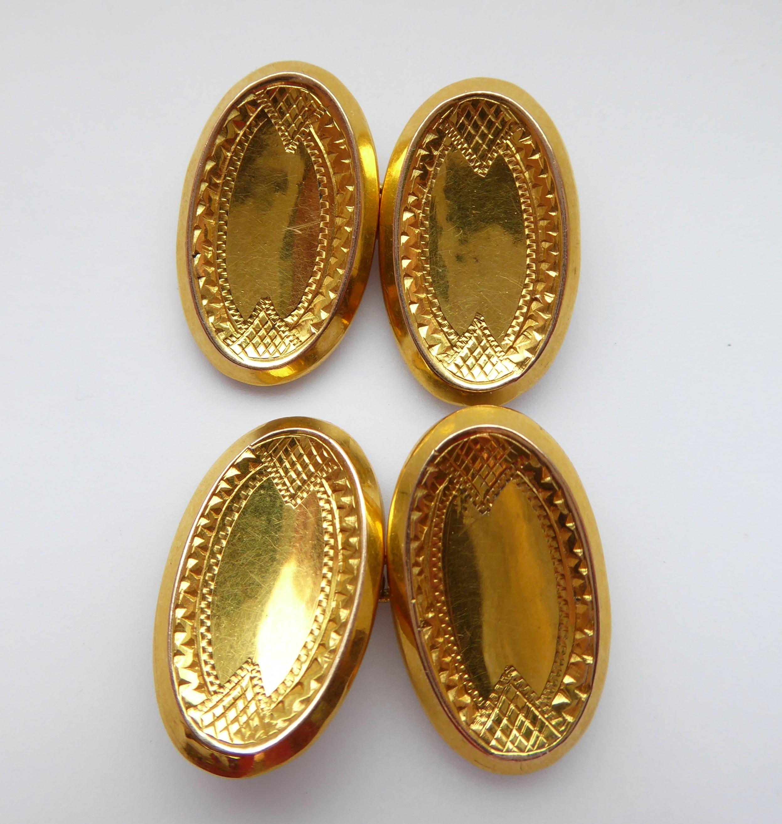 A pair of antique gold cufflinks dating from 1911 and hallmarked at Chester Assay Office in England.  The cufflinks are oval shaped with a chamfered edge to a slightly dished panel.  The edge of the panel are decorated with a doule row of 