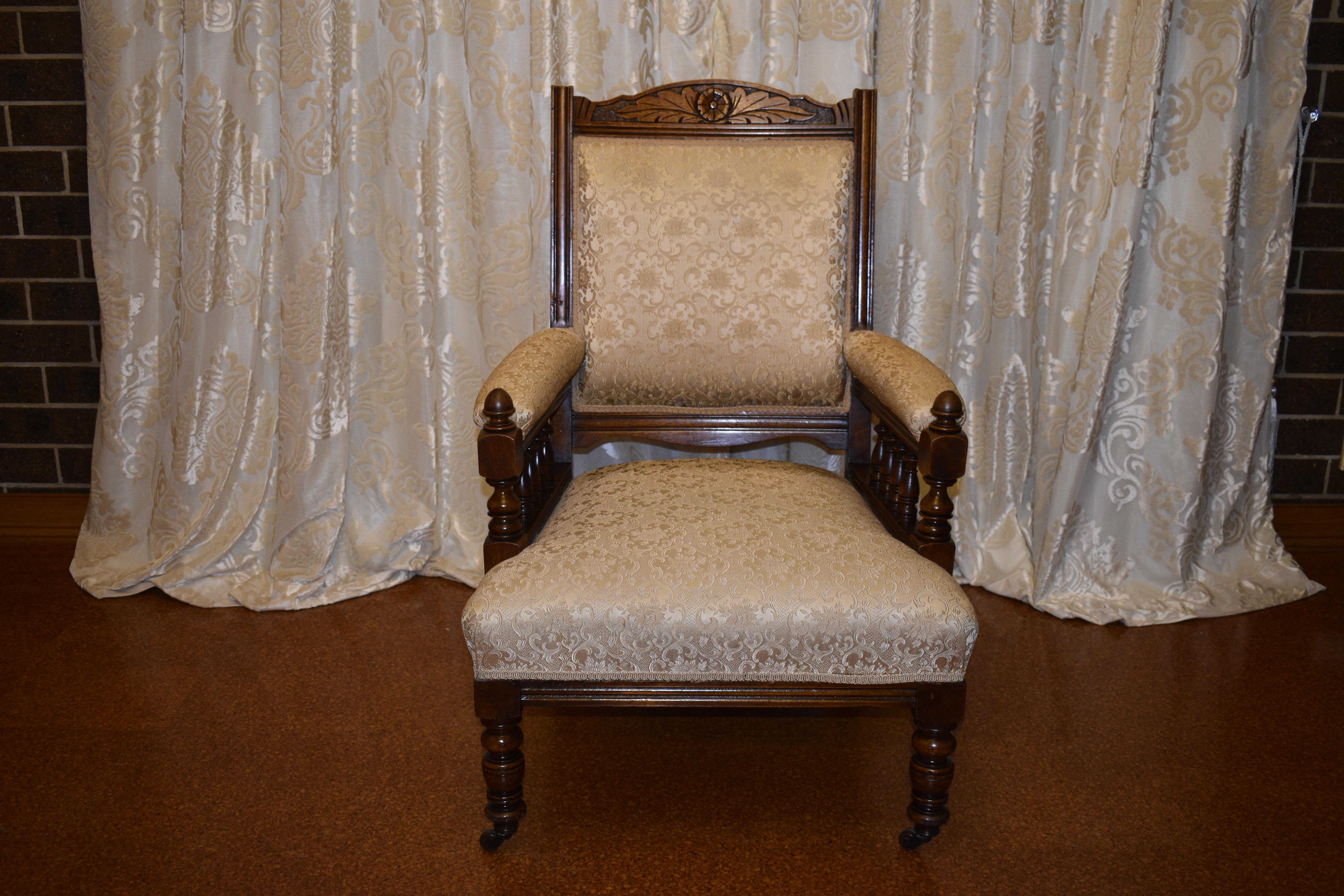 Edwardian grandfather armchair with front castors, carved detail throughout, comes with cushion and arm rest protectors.

Circa: 1900

Country of Origin: England

Measurements: 96cm high, 65cm width, 65cm deep

Antiques Yeah offers delivery to your