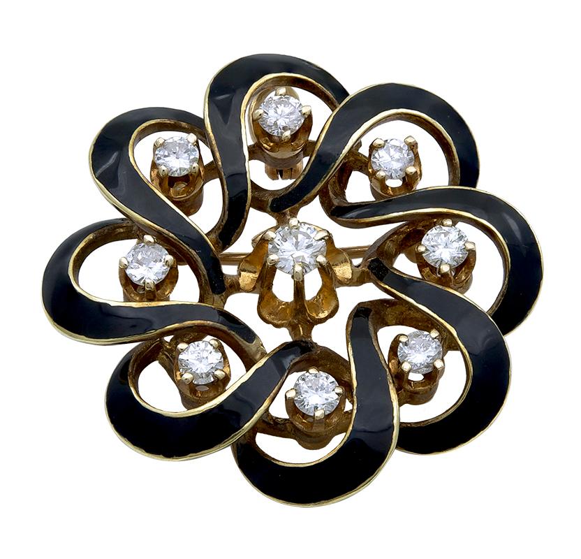 Graceful antique brooch.  Curved lobe flower-form 14K yellow gold and black enamel.  Set with approximately 1.0 carat of  bright white diamonds, which contrast beautifully with the black enamel decoration.   1 1/8