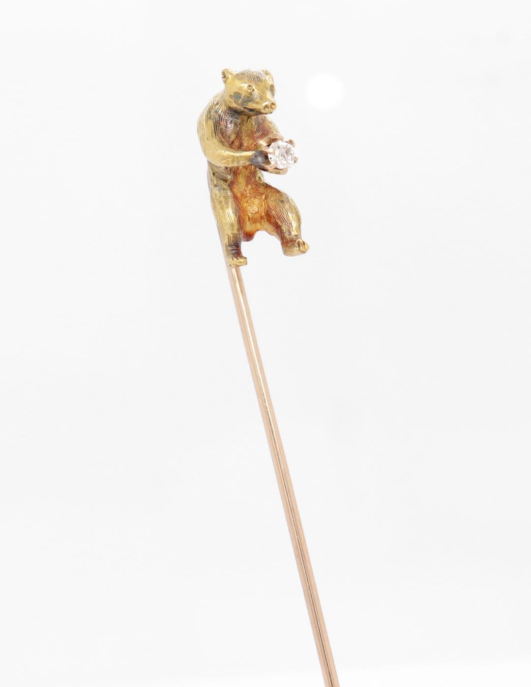 A fine antique stickpin.

In yellow gold with a white, round-cut diamond.

In the form of a walking bear in full stride.

The 18k bear top is mounted on a 10k gold pin.

Simply a wonderful Ursine stick pin!

Date:
20th Century

Overall Condition:
It