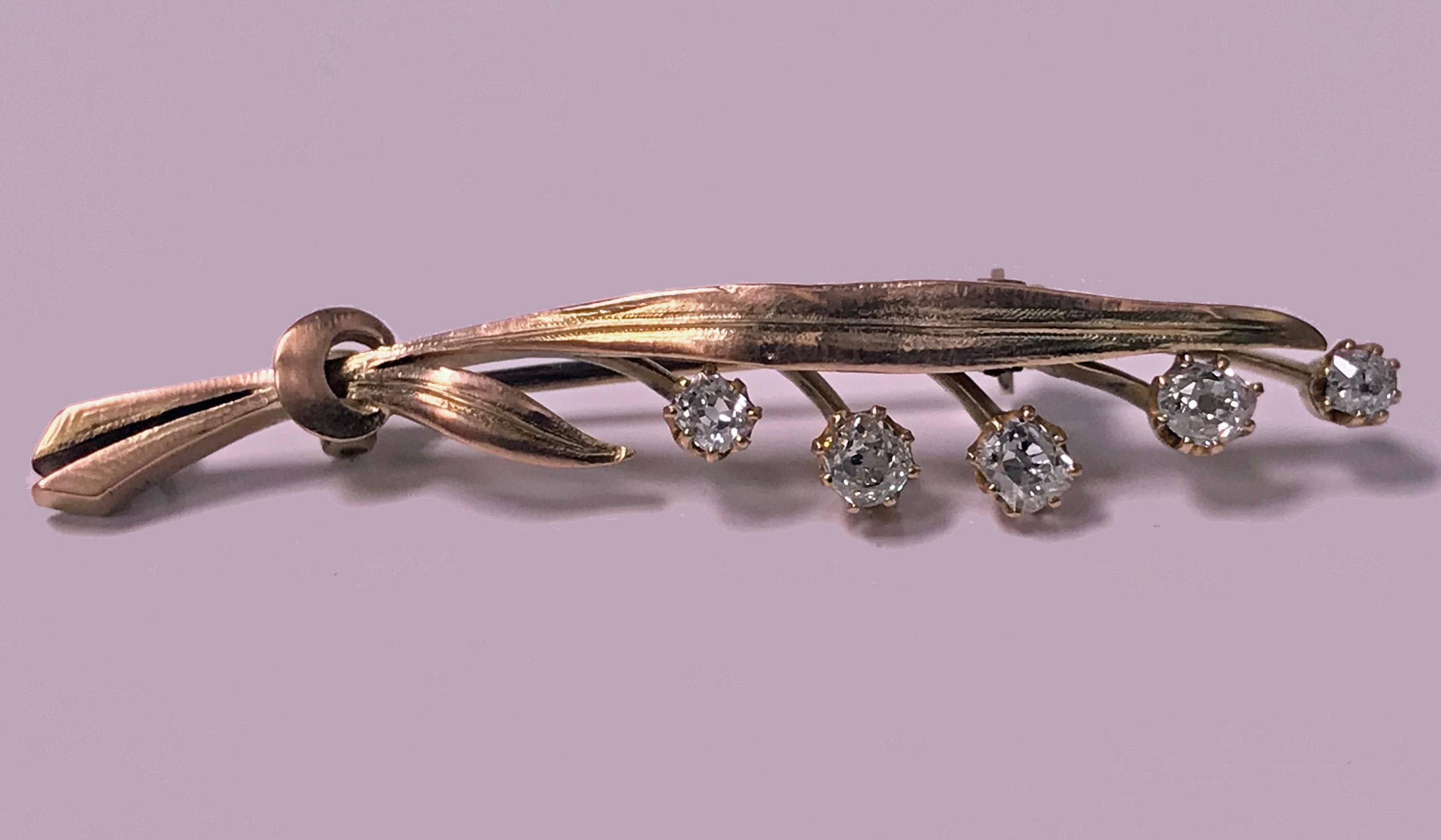 Antique 15K pink and yellow Gold Diamond Floral Leaf Branch Brooch, C.1910. The brooch depicting a textured floral leaf branch, the five `buds' each set with an old mine cut diamond, total diamond weight approximately 0.60 ct, average SI1, average