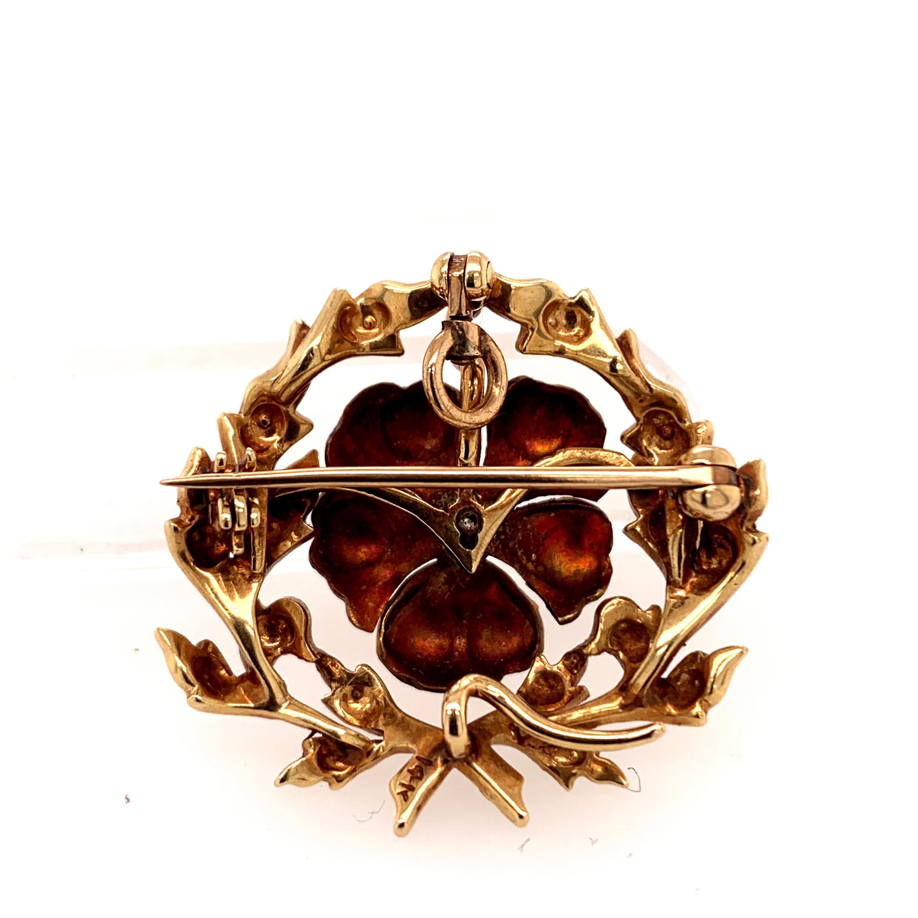 Very fine antique pansy pin/drop.  The center is a figural 