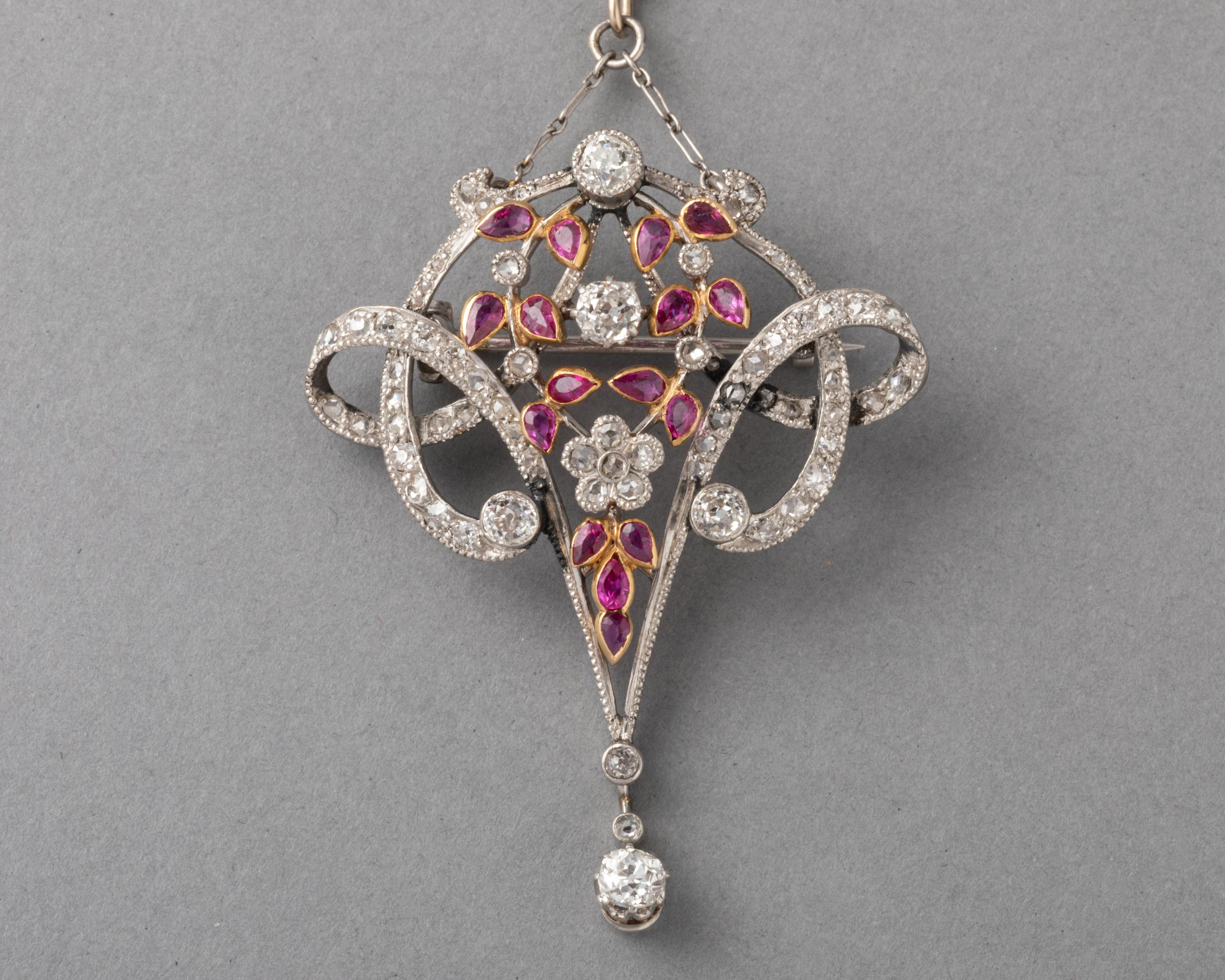 Antique Gold Diamonds and Rubies Pendant Necklace

Beautiful antique pendant necklace. Made in France circa 1900.
18k gold, rubies and diamonds. 
Dimensions: 4.5 cm height, 3.5 cm width.
HAllmarks of Maker (JLR) and numbers. 
The chain measures 60
