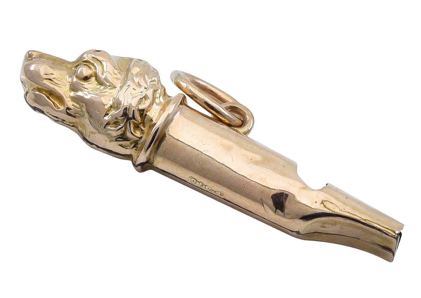A whistle with a figural 'dog head.