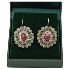 Antique gold earrings with rubies, emeralds and diamonds.