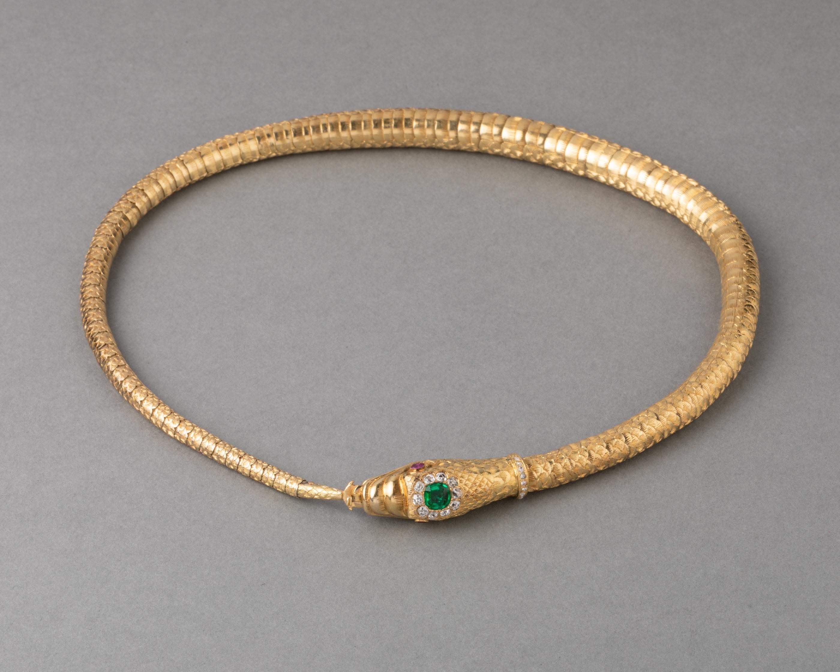 Antique Gold Emerald and Diamonds Snake Necklace

Very beautiful necklace made in France circa 1830.

The length is 37.5 cm 
Made in yellow gold 18k. Set with Emerald (1 carat estimate) and diamonds (0.60 estimate), old mine cut.
Total weight is