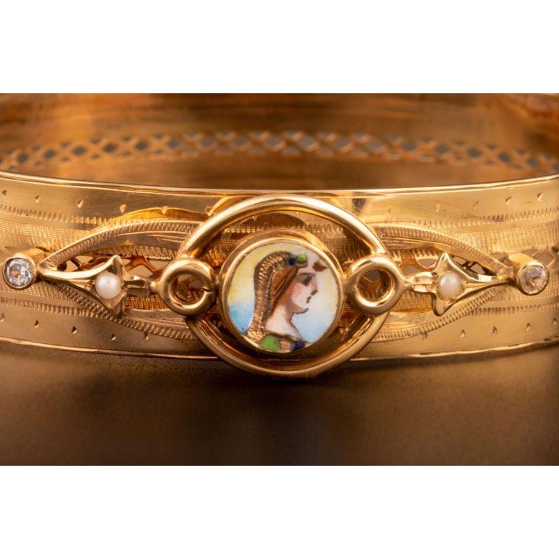 A lovely antique gold enamel bracelet. Made of solid 12 carat yellow gold, this beautiful bracelet is set with an Egyptian revival enamel centerpiece. The bracelet is in outstanding antique condition. It comes from Italy and dates back to mid/late