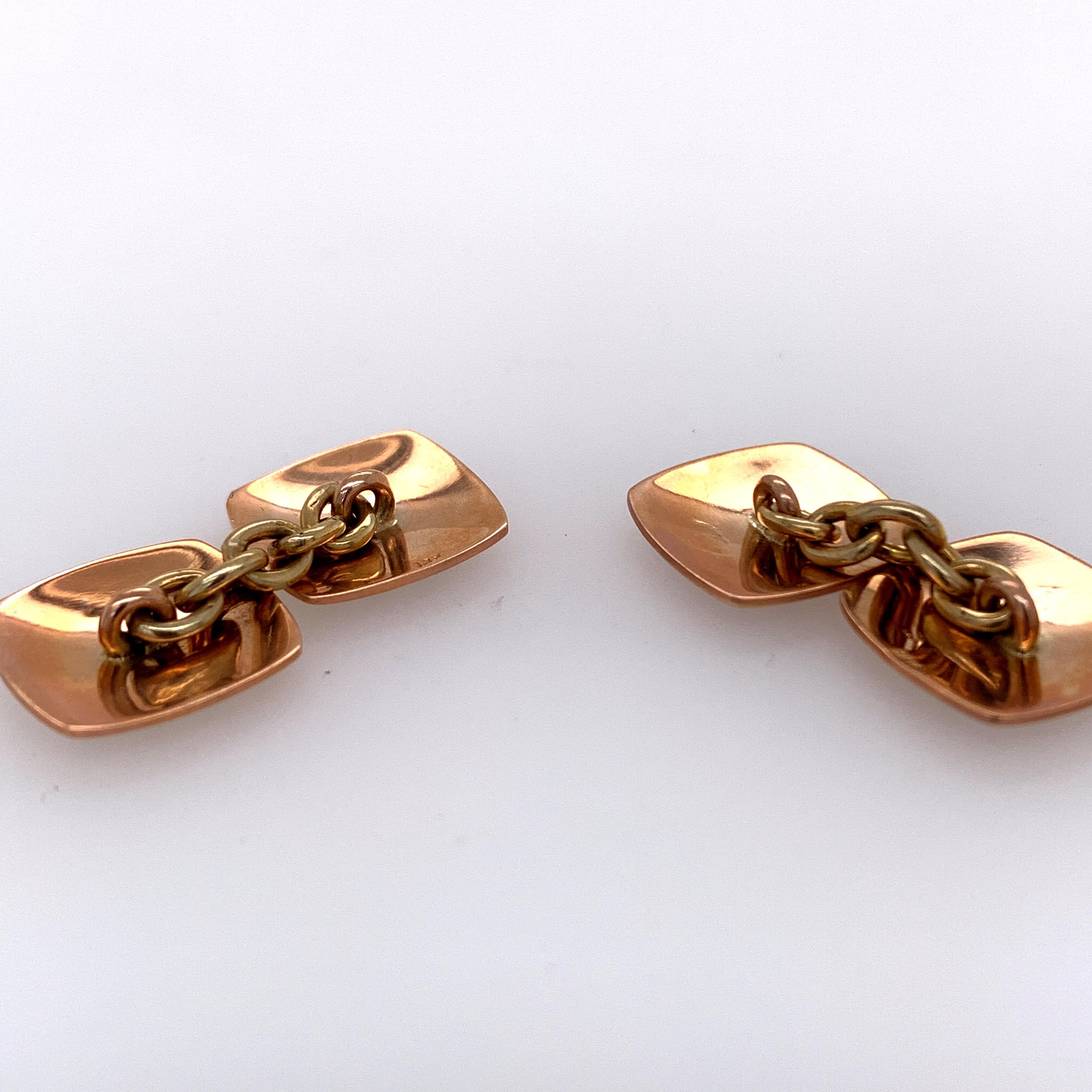 Dynamic cufflinks:  double-sided with black and white checkerboard pattern.  Set in 14K rose gold.  2/3