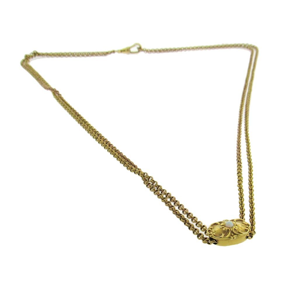 Antique long chain with slide in gold-fill, 56″ long, with clasp at one end is composed of double wire rolo links and can be worn as a necklace or used as a pocket watch chain. The 14K gold Art Nouveau slide is set with an opal