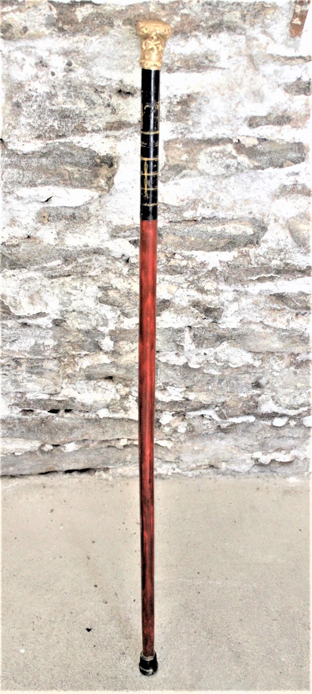 This antique gold-filled and handcrafted presentation walking stick is hallmarked for presumably an English maker and believed to have been made in circa 1910 in the period Edwardian style. The walking stick's handle is clearly engraved that it was